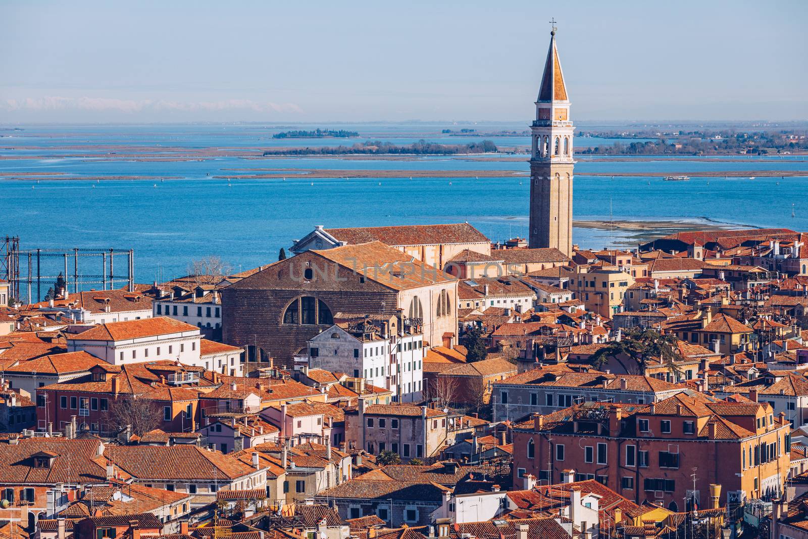 Venice panoramic aerial view with red roofs, Veneto, Italy. Aerial view with dense medieval red roofs of Venice, Italy 