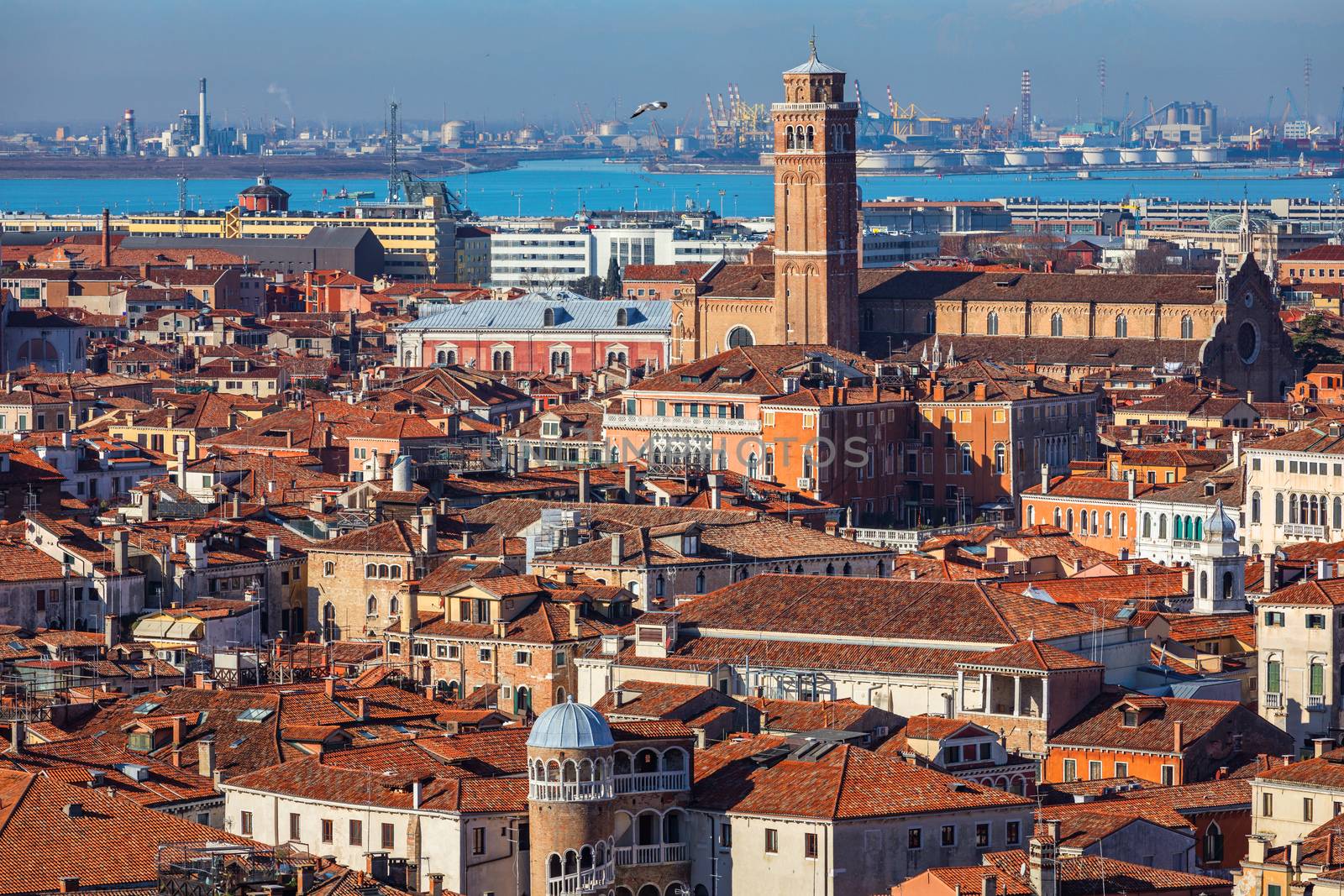 Venice panoramic aerial view with red roofs, Veneto, Italy. Aerial view with dense medieval red roofs of Venice, Italy 