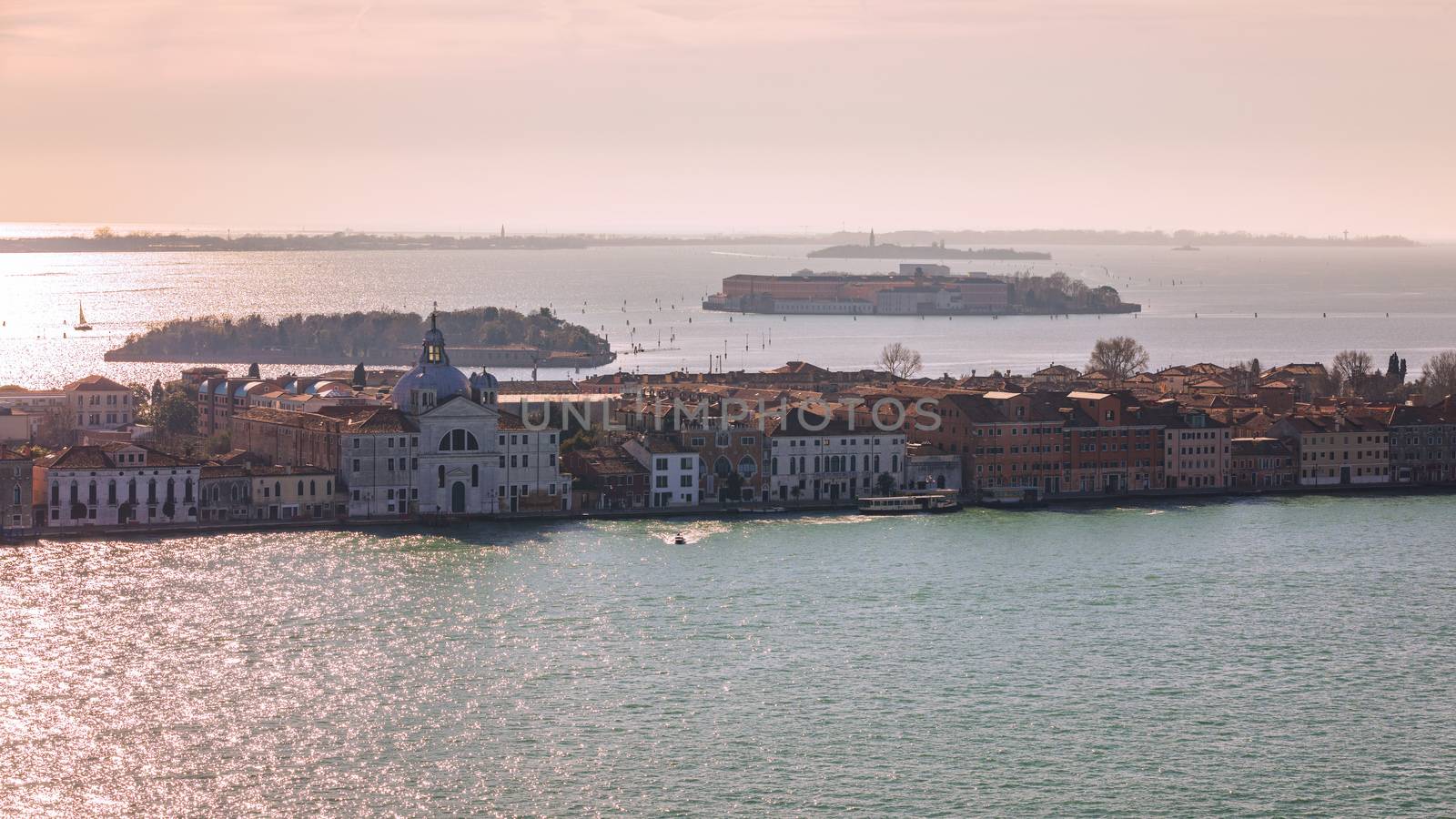 Venice panoramic aerial view with red roofs, Veneto, Italy. Aerial view with dense medieval red roofs of Venice, Italy 