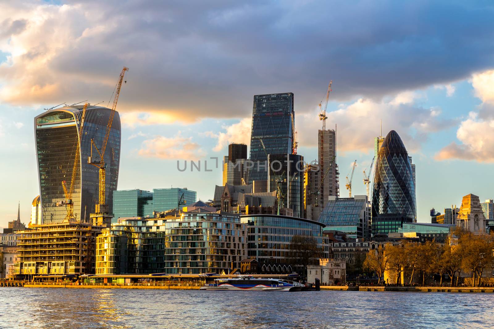 Business district with famous skyscrapers and landmarks at golden hour, London, UK
