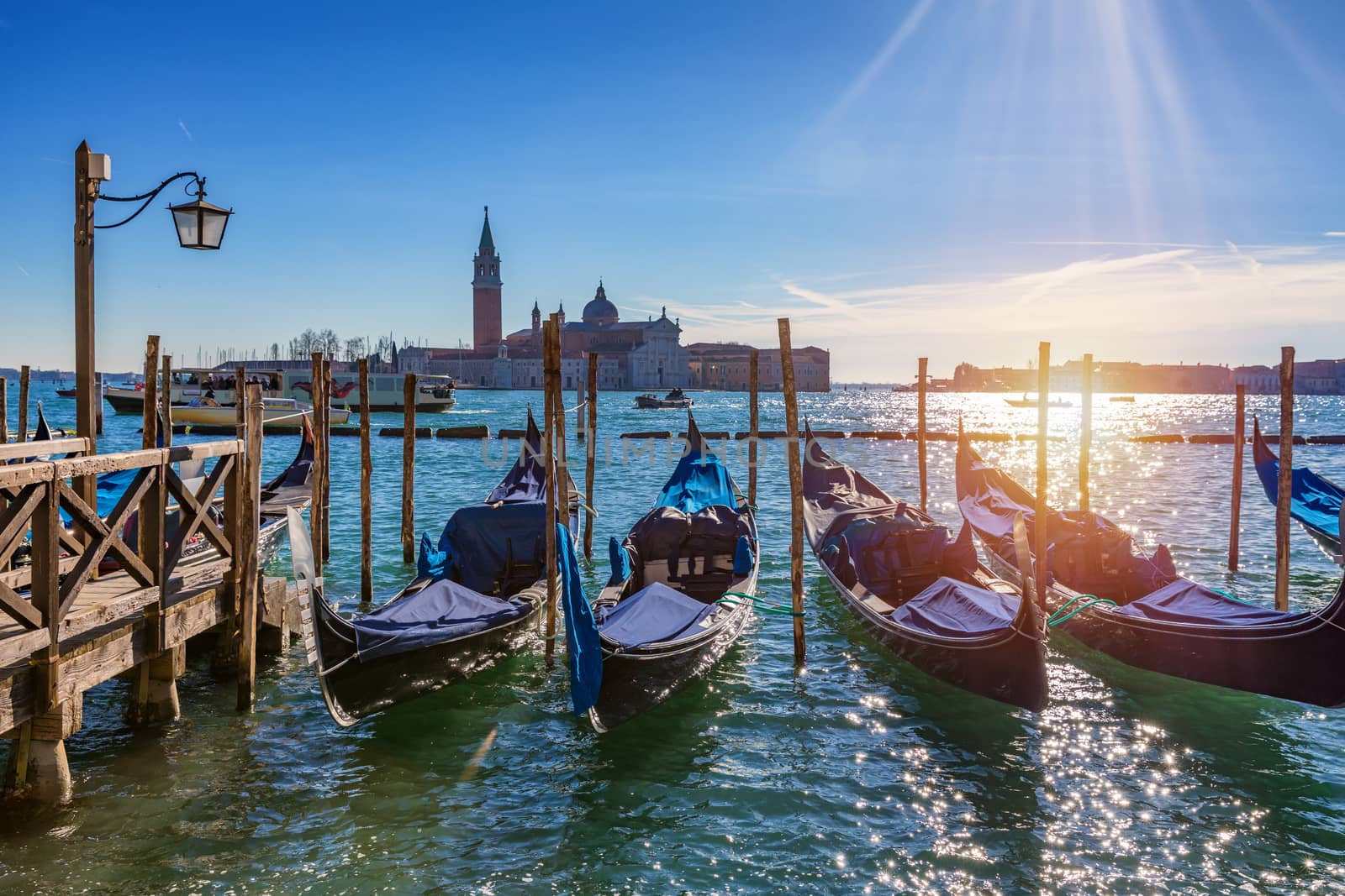 Sunny day in San Marco square, Venice, Italy. Venice Grand Canal. Architecture and landmarks of Venice. Venice postcard with Venice gondolas