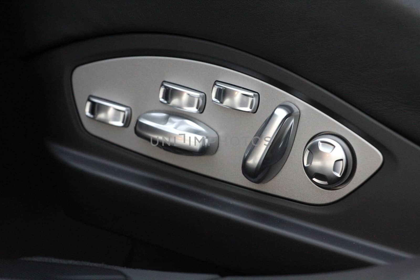 Buttons for adjusting seat position. Car interior detail