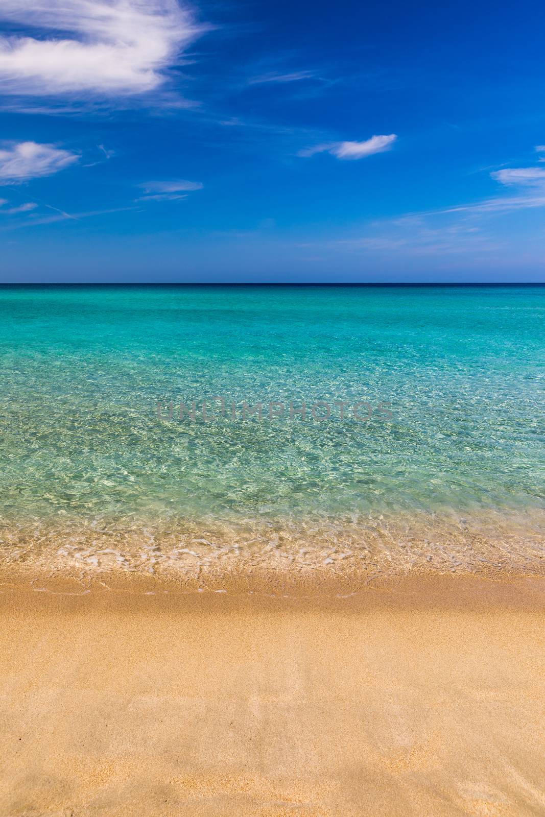 Yellow warm sand and summer sea with sky and free space. Sea, Sand, Sky and summer day. Beach and sea on a summer day, travel concept, vacation and relaxation. Summer sand beach and sea background.