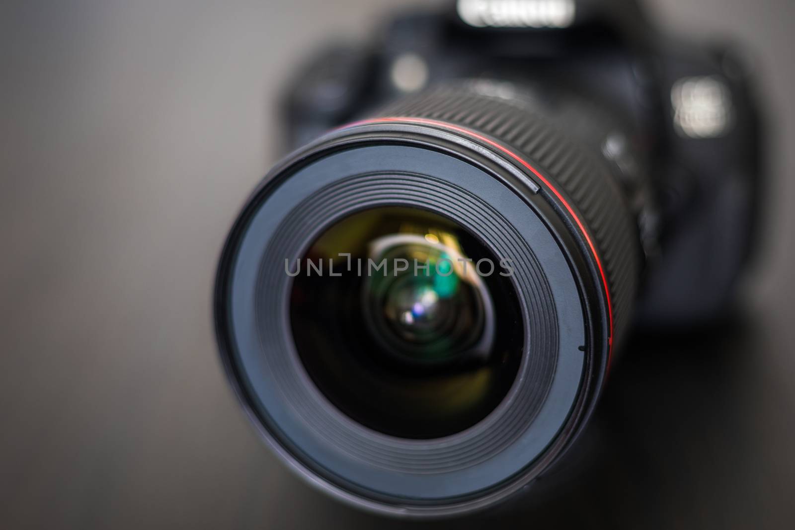DSLR camera isolated on a black background. Black DSLR Camera isolated. Photo Camera or Video lens close-up on black background DSLR objective