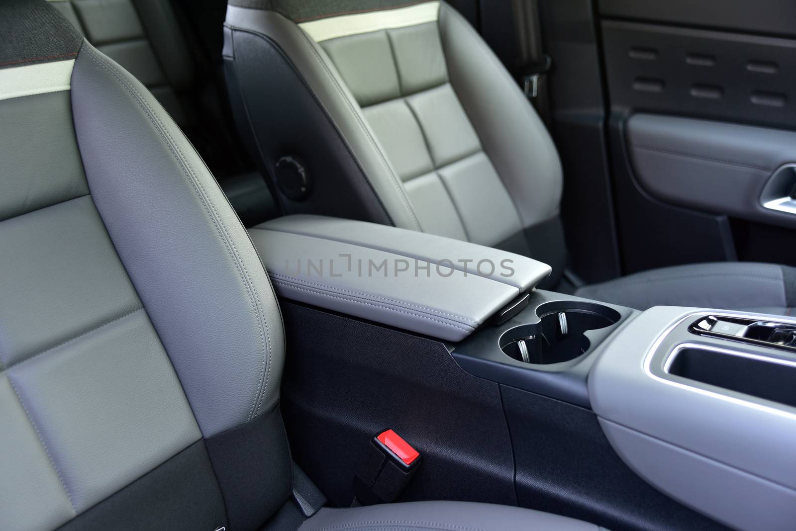 armrest in the luxury passenger car between the front seats