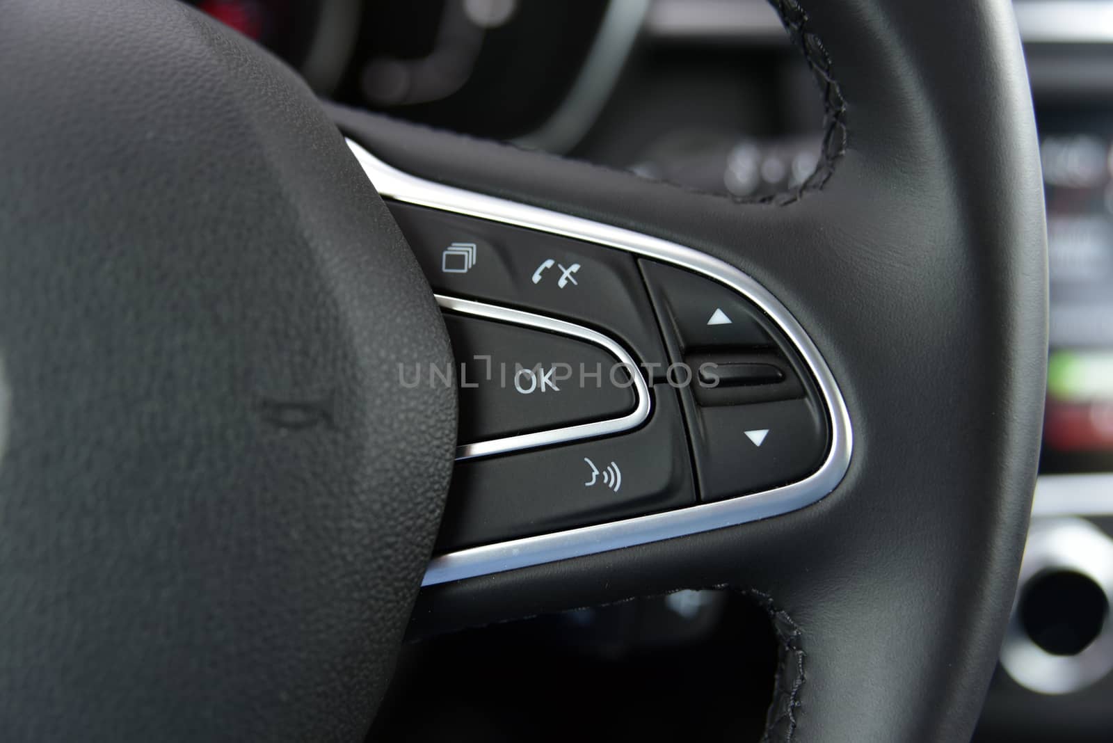 detail on the steering wheel to control cell phones