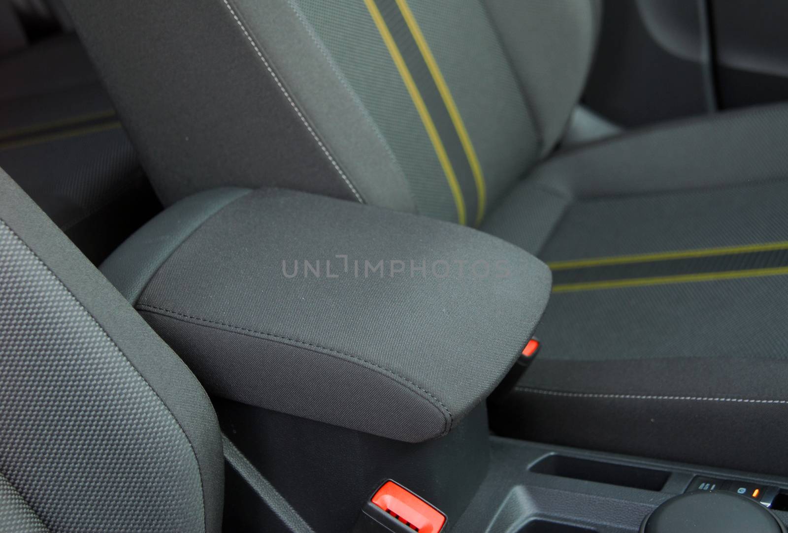 armrest in the luxury passenger car between the front seats by aselsa