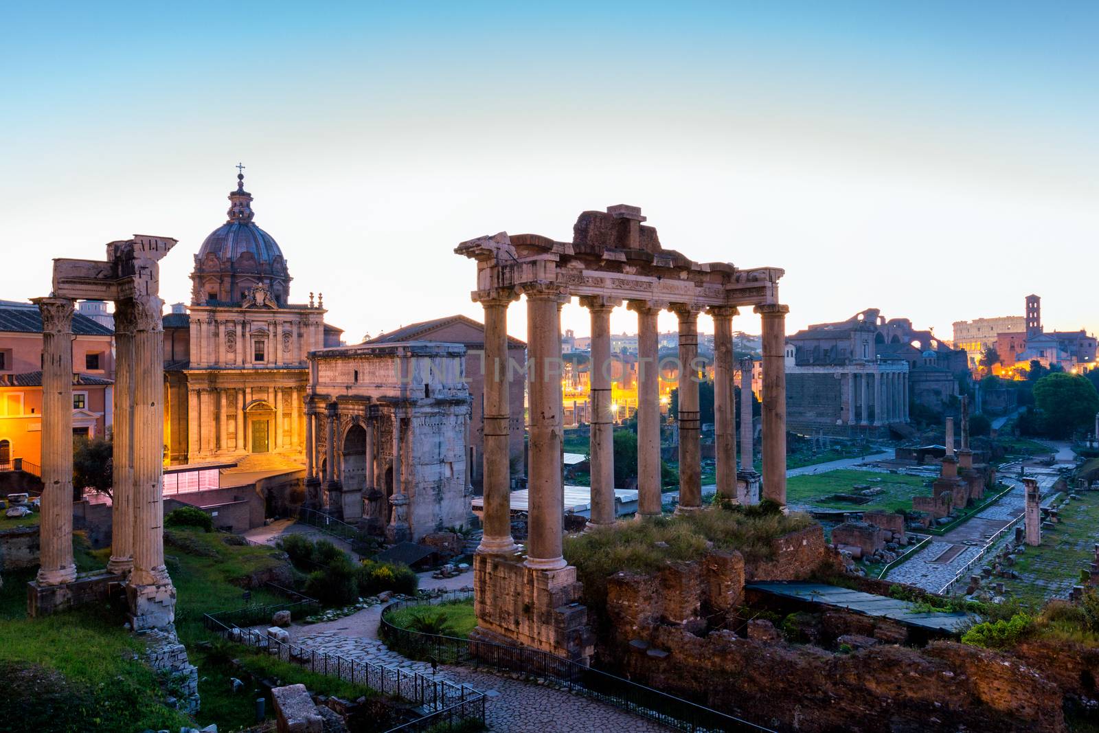 Roman ruins in Rome, Forum. Ancient ruins of the Romanum Forum. Ruins of Septimius Severus Arch and Saturn Temple, Rome, Italy.