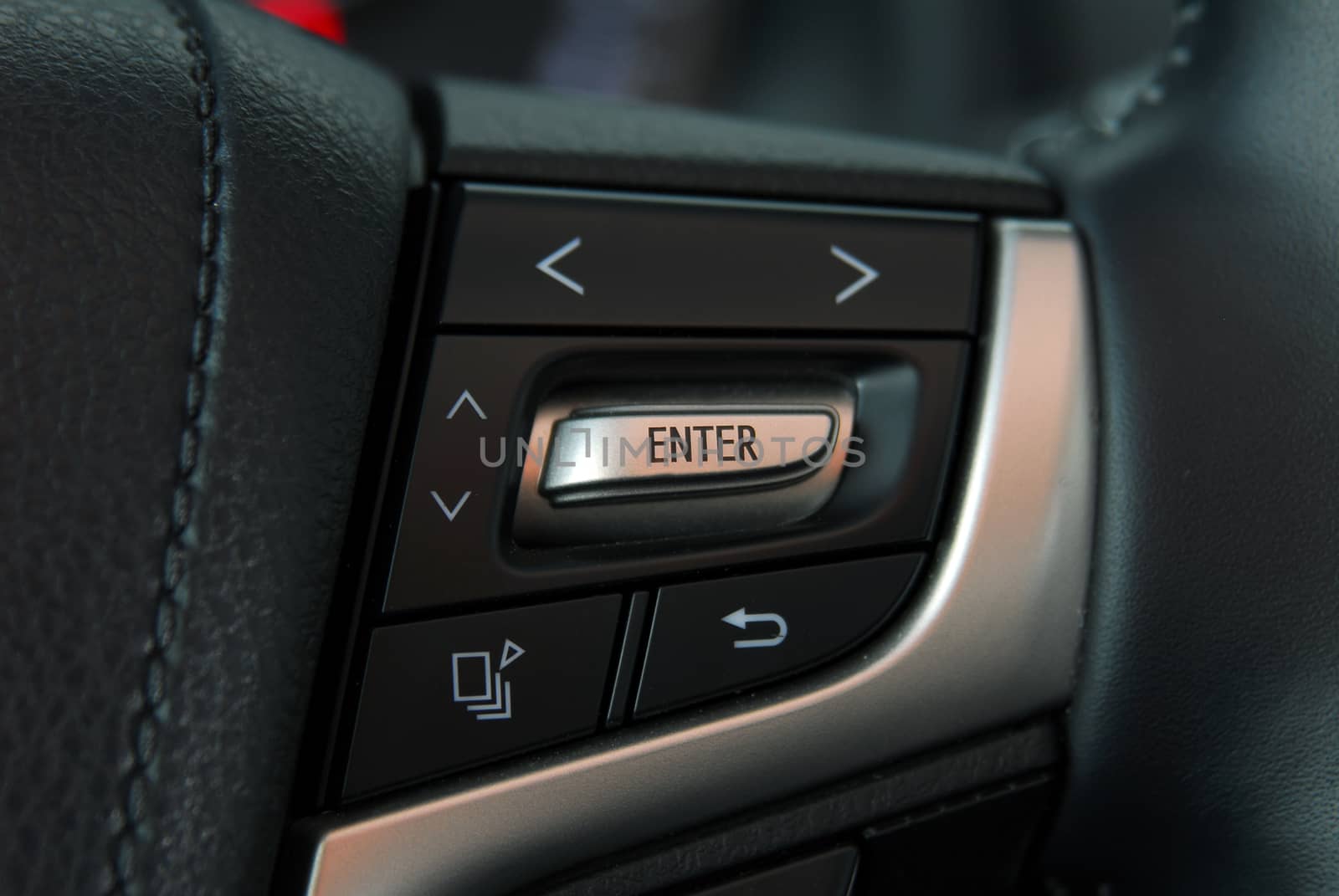 detail on the steering wheel to control cell phones