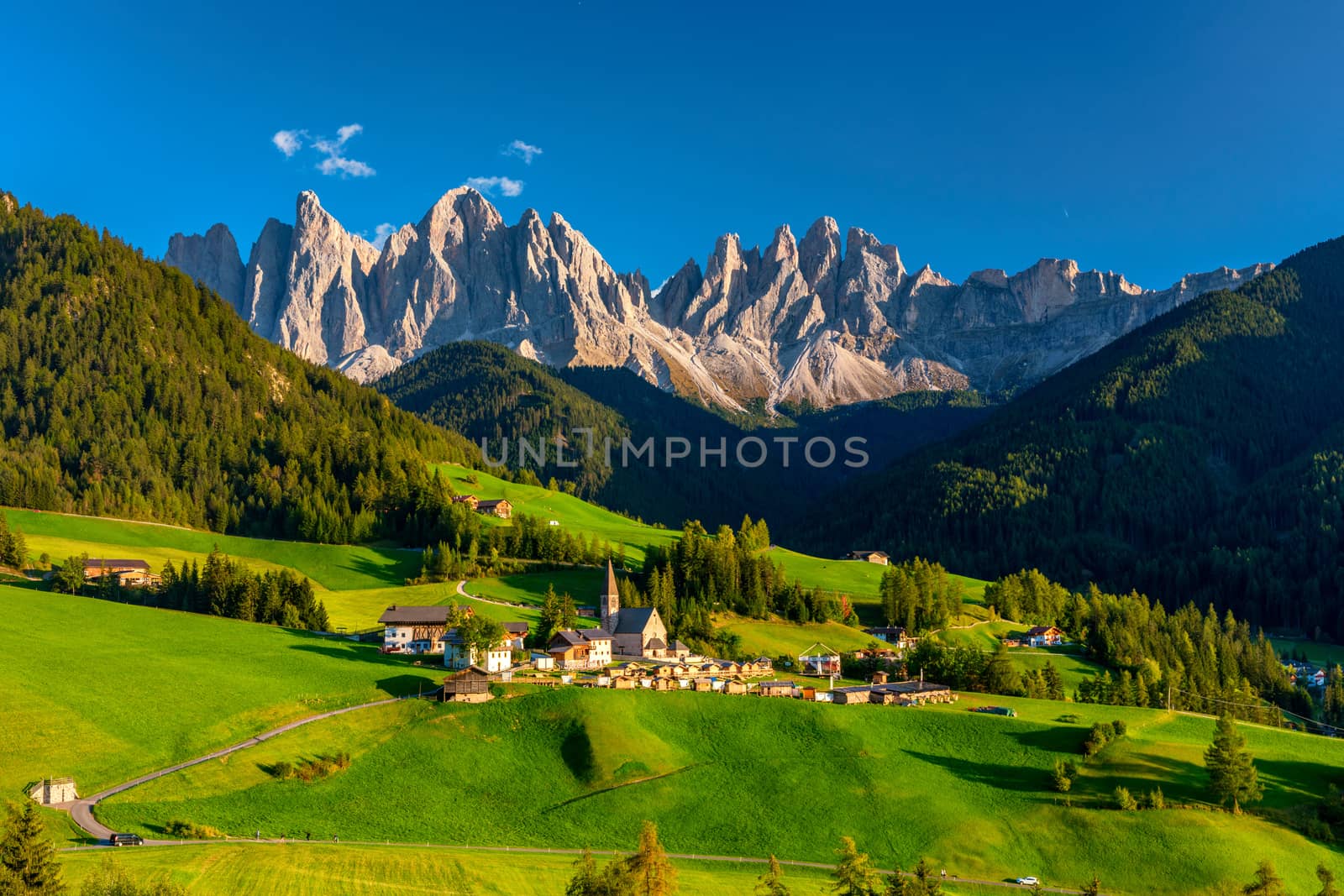 Santa Maddalena (Santa Magdalena) village with magical Dolomites mountains in background, Val di Funes valley, Trentino Alto Adige region, South Tyrol, Italy, Europe. Santa Maddalena Village, Italy. 