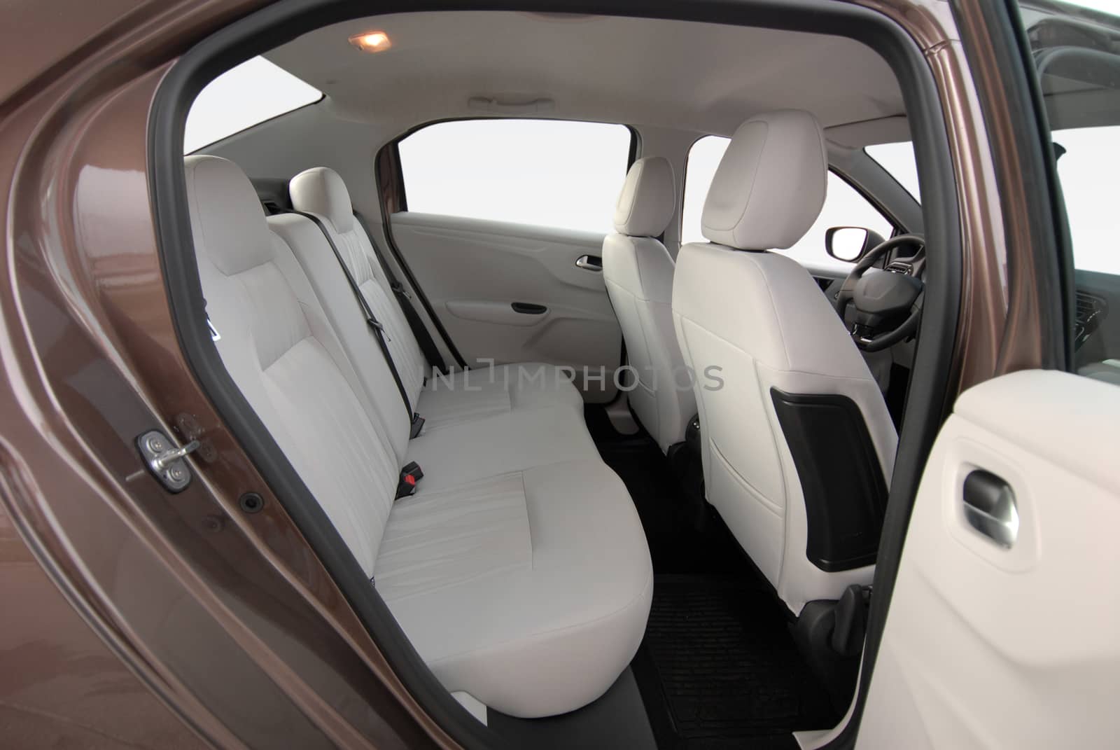 the white rear seat of a luxury passenger car