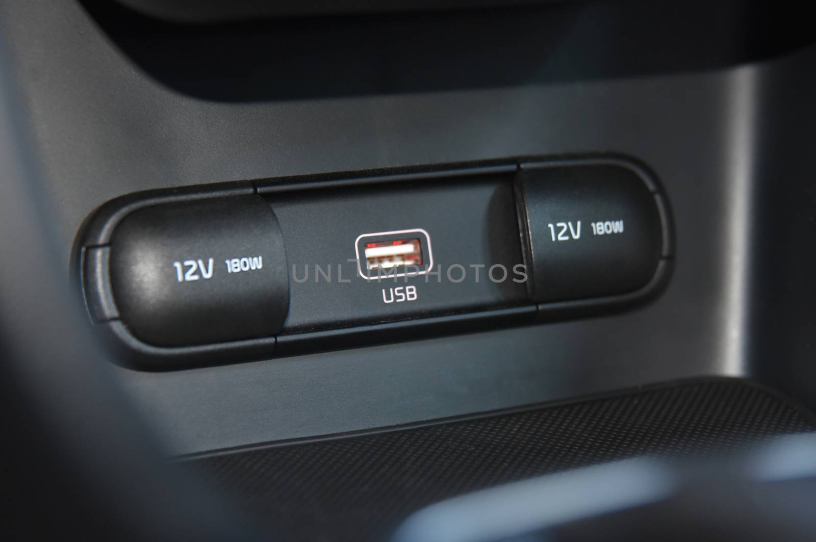 12V socket, wireless mobile phone charger, USB port, AUX port on car dashboard