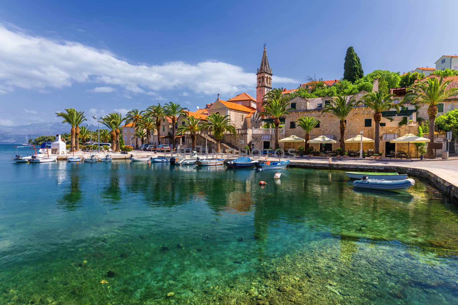 Fishing boats in Splitska village with beautiful port, Brac island, Croatia. Village of Splitska on Brac island seafront view, Dalmatia, Croatia, Croatia.