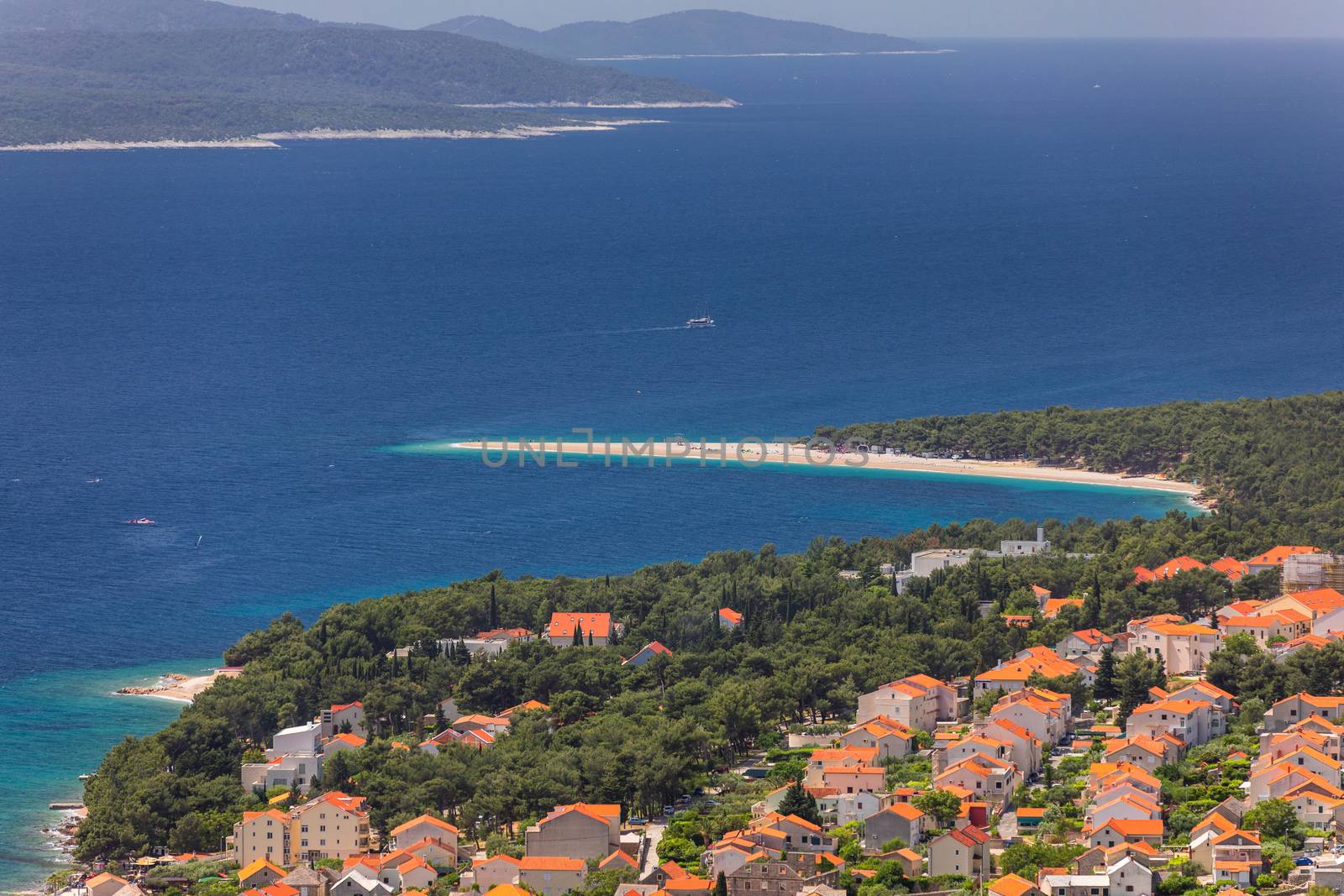 Zlatni Rat (Golden Cape or Golden Horn) famous turquoise beach in Bol town on Brac island, Dalmatia, Croatia. Zlatni Rat sandy beach at Bol on Brac island of Croatia in summertime.