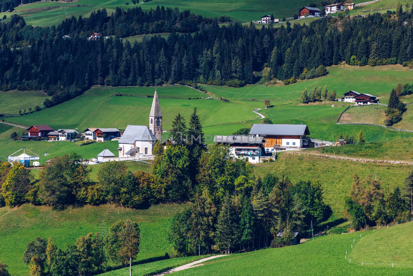 Santa Maddalena (Santa Magdalena) village with magical Dolomites mountains in background, Val di Funes valley, Trentino Alto Adige region, South Tyrol, Italy, Europe. Santa Maddalena Village, Italy. 