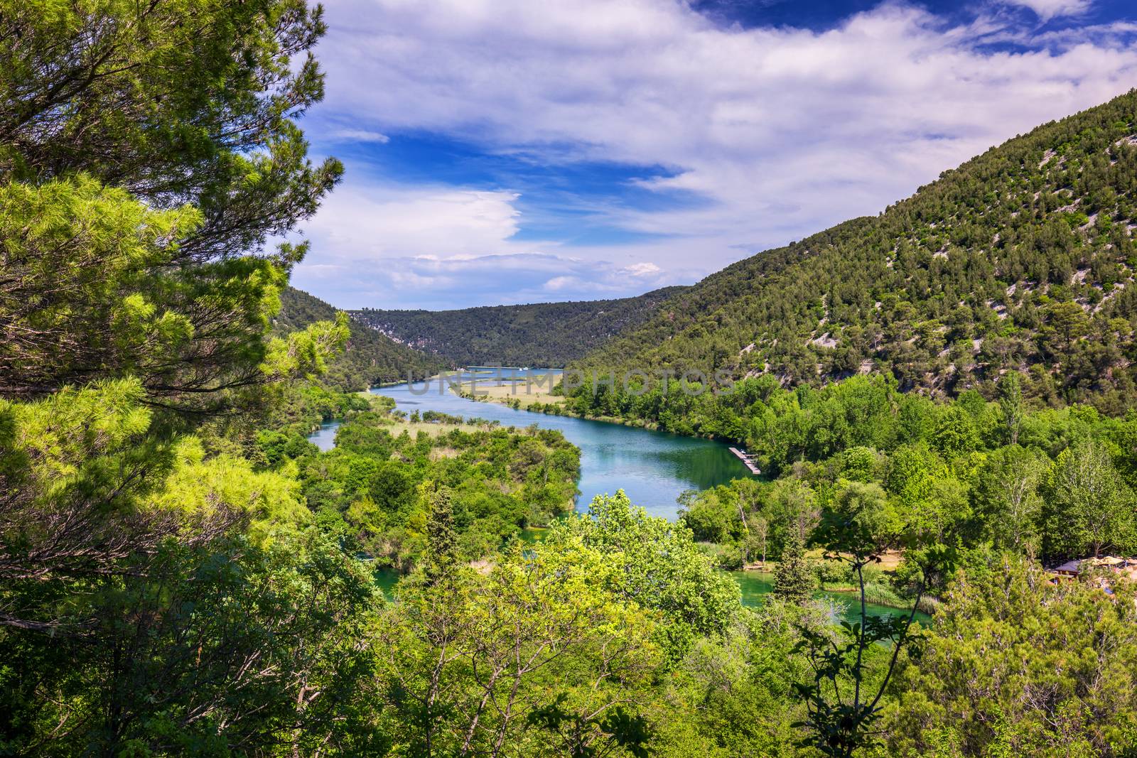 Waterfalls Krka, National Park, Dalmatia, Croatia. View of Krka National Park, Roski Slap location, Croatia, Europe. Beautiful world of Mediterranean countries. Traveling concept background.