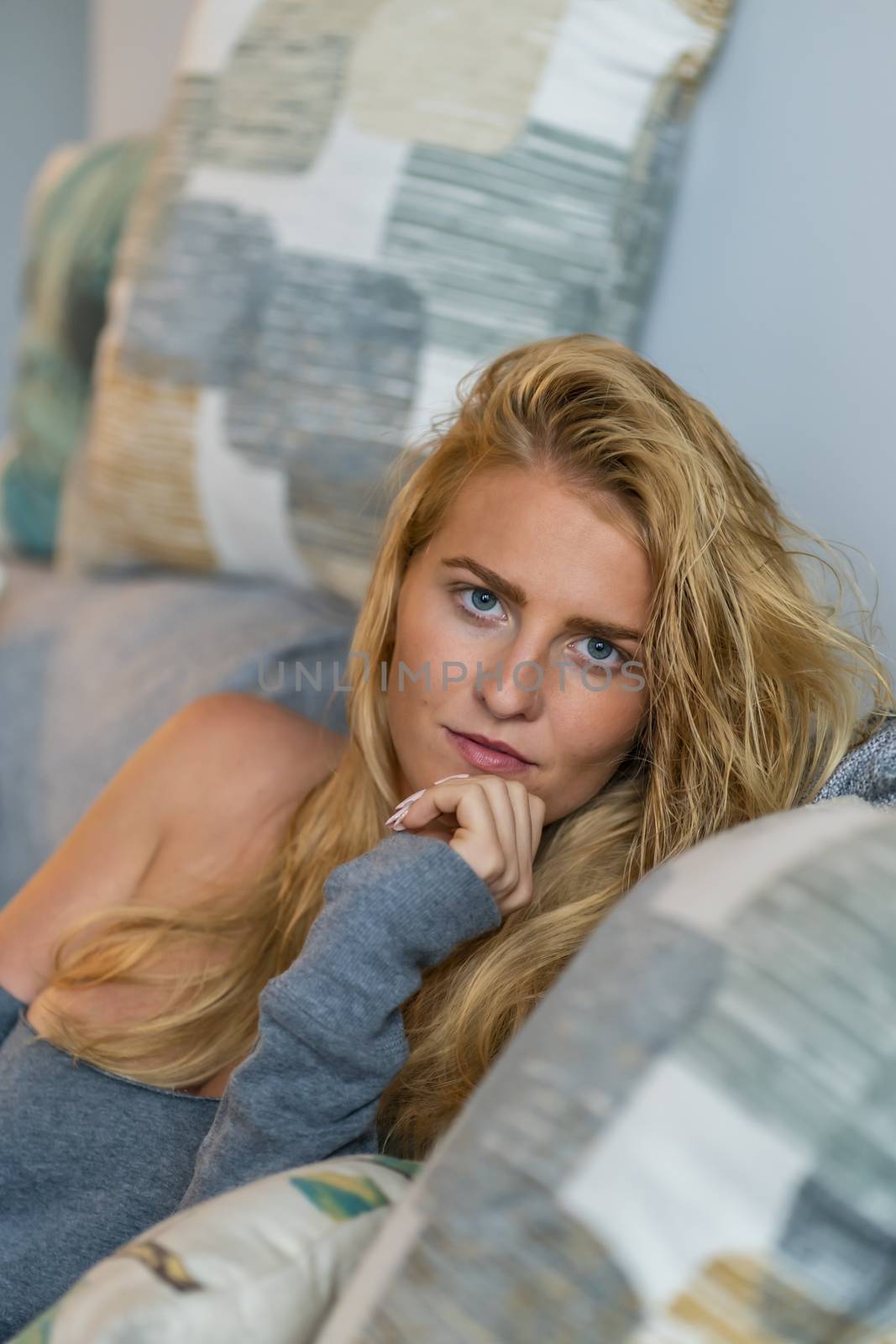 A gorgeous blonde model enjoys a day at home before work