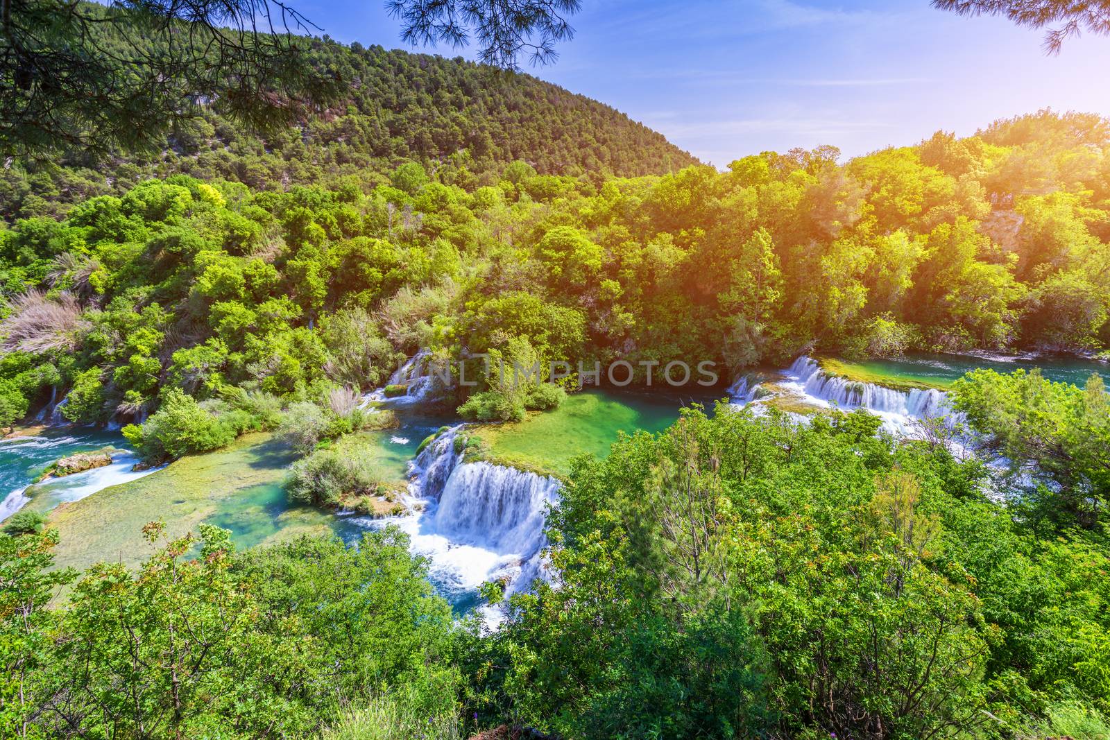 Waterfalls Krka, National Park, Dalmatia, Croatia. View of Krka National Park, Roski Slap location, Croatia, Europe. Beautiful world of Mediterranean countries. Traveling concept background.