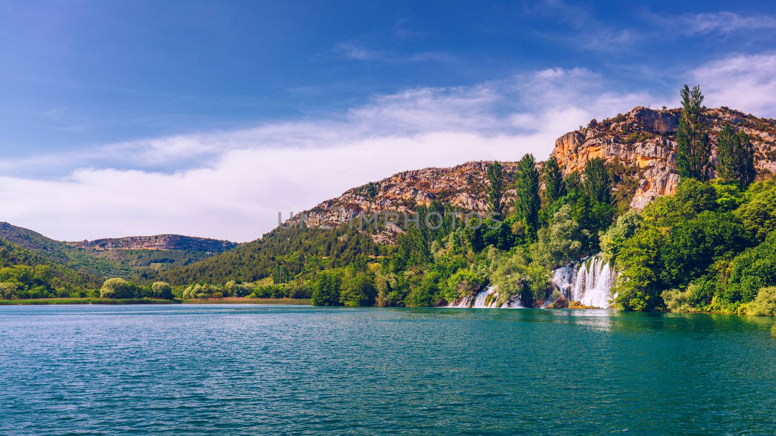 Waterfalls Krka, National Park, Dalmatia, Croatia. View of Krka National Park, Roski Slap location, Croatia, Europe. Beautiful world of Mediterranean countries. Traveling concept background.