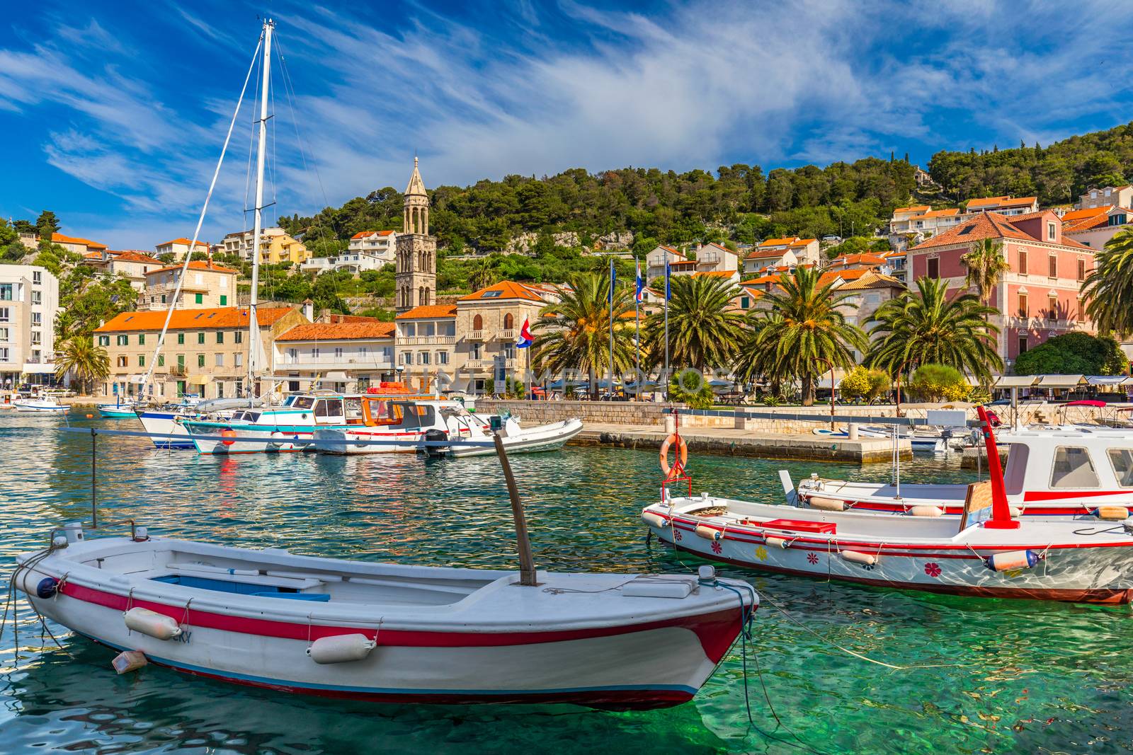 View at amazing archipelago with boats in front of town Hvar, Croatia. Harbor of old Adriatic island town Hvar. Popular touristic destination of Croatia. Amazing Hvar city on Hvar island, Croatia. 