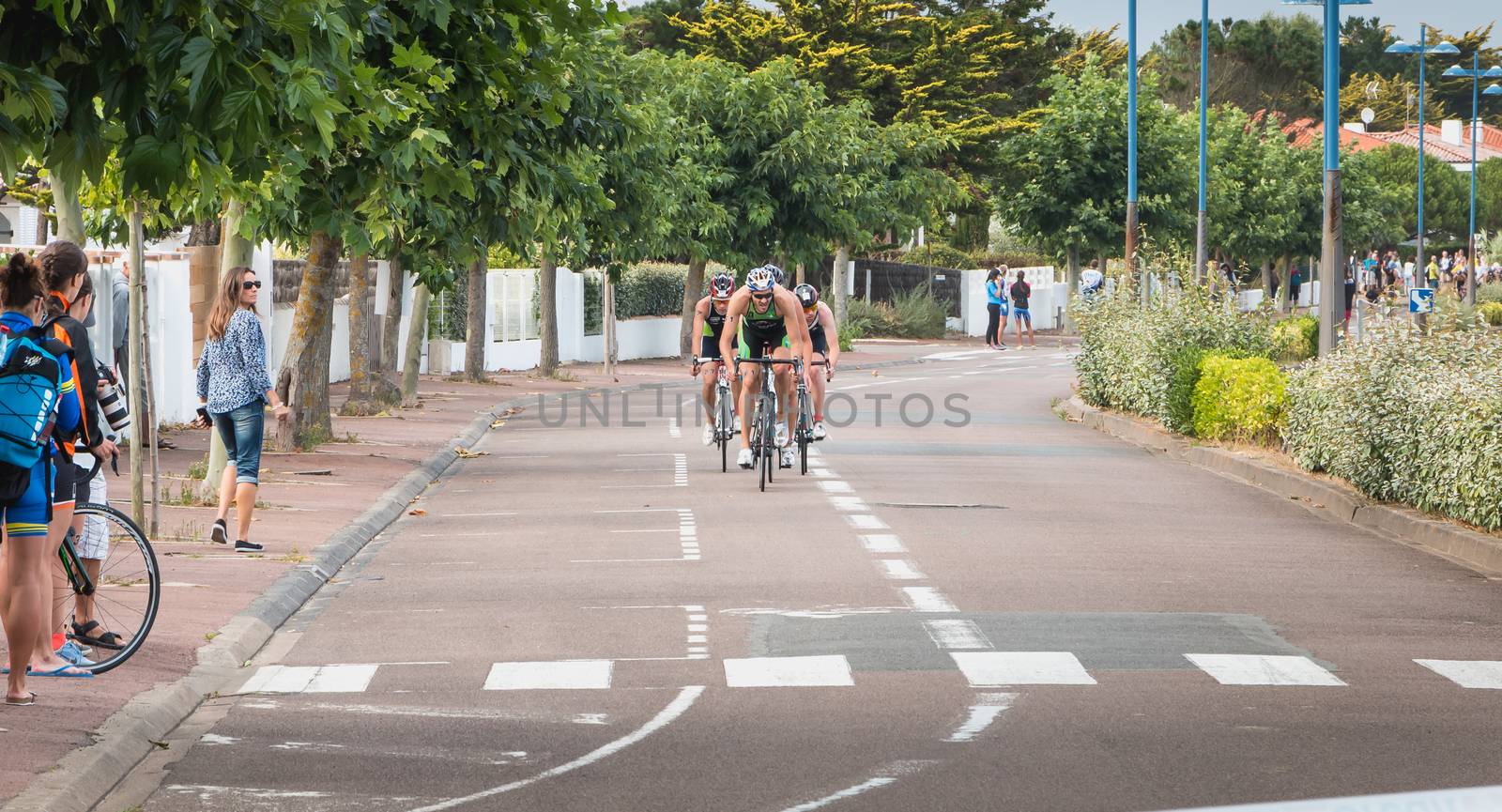 Saint Gilles Croix de Vie, France - September 10, 2016: frontrunners in a bend on the final Triathlon Championship of France in the category D3