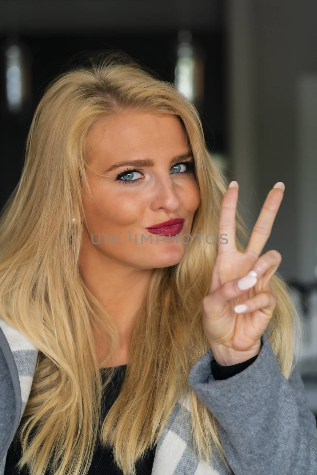 A gorgeous blonde model enjoys a day at home before work