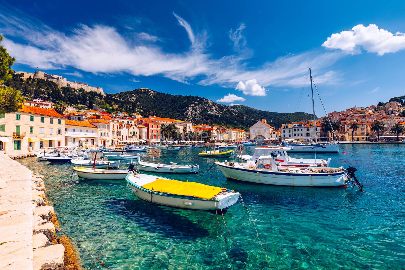 View at amazing archipelago with boats in front of town Hvar, Croatia. Harbor of old Adriatic island town Hvar. Popular touristic destination of Croatia. Amazing Hvar city on Hvar island, Croatia. 
