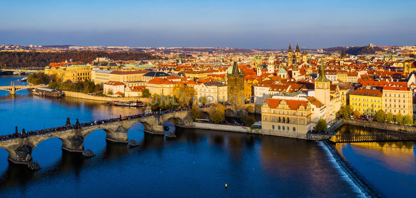 Aerial Prague panoramic drone view of the city of Prague at the Old Town Square, Czechia. Prague Old Town pier architecture and Charles Bridge over Vltava river in Prague at sunset, Czech Republic. 