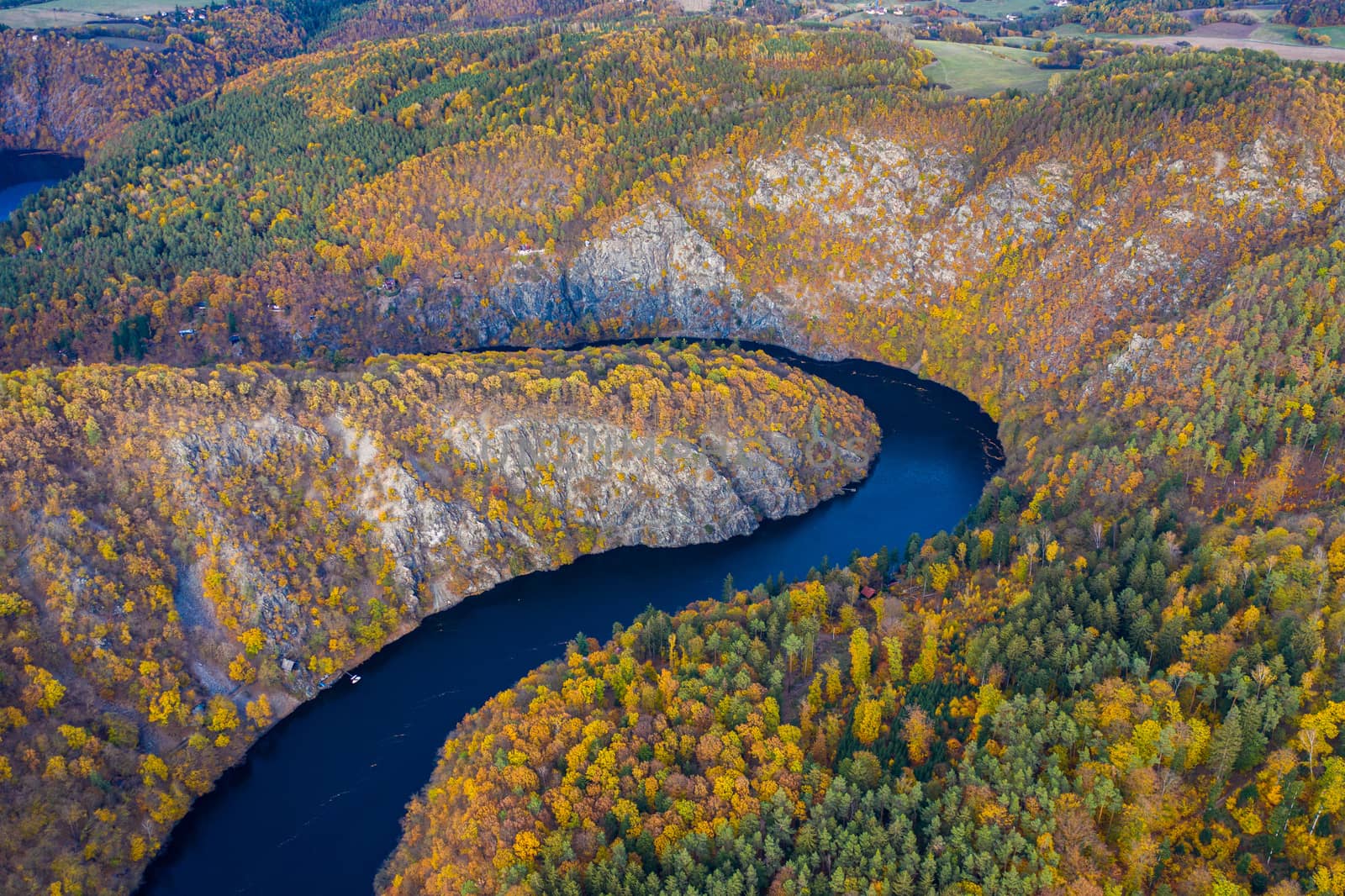 Beautiful Vyhlidka Maj, Lookout Maj, near Teletin, Czech Republic. Meander of the river Vltava surrounded by colorful autumn forest viewed from above. Tourist attraction in Czech landscape. Czechia.