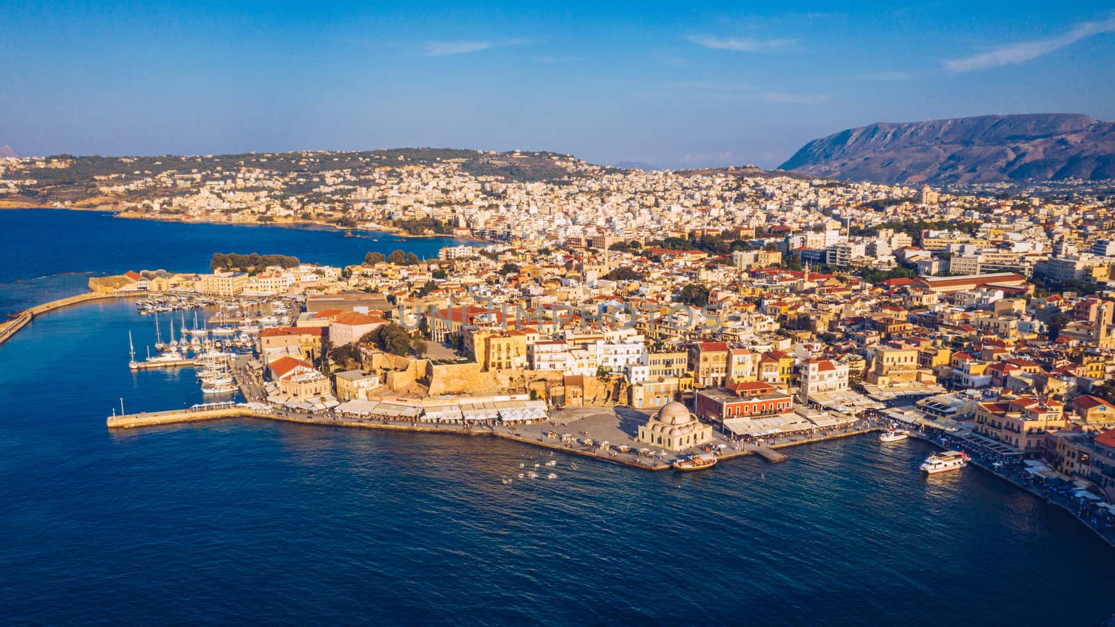 Picturesque old port of Chania. Landmarks of Crete island. Greece. Aerial view of the beautiful city of Chania with it's old harbor and the famous lighthouse, Crete, Greece.
