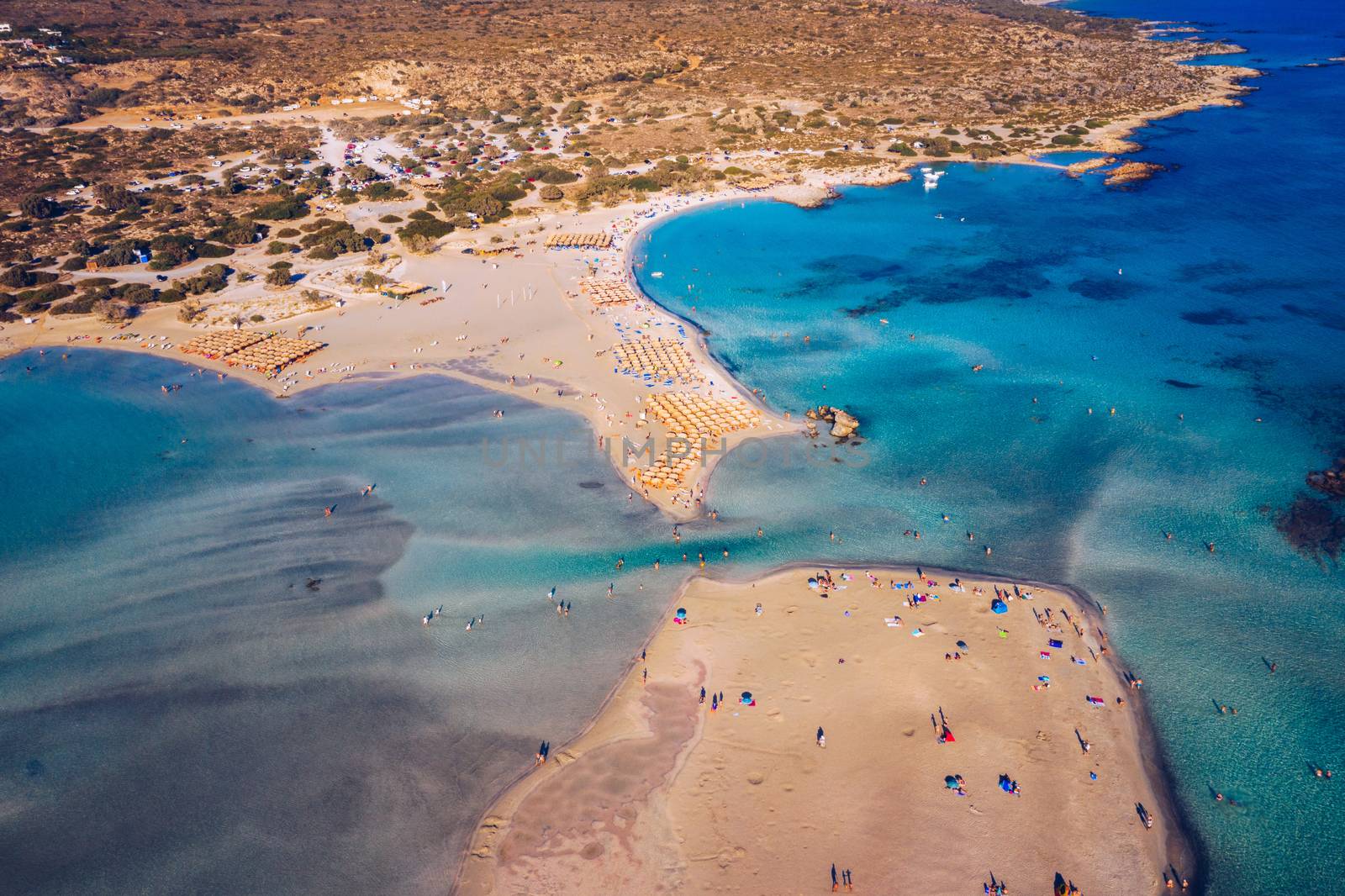 Aerial view of beautiful tropical Elafonissi Beach with pink sand. View of a nice tropical Elafonissi beach from the air. Beautiful sky, sea, resort. Elafonissi beach, Crete, Greece.
