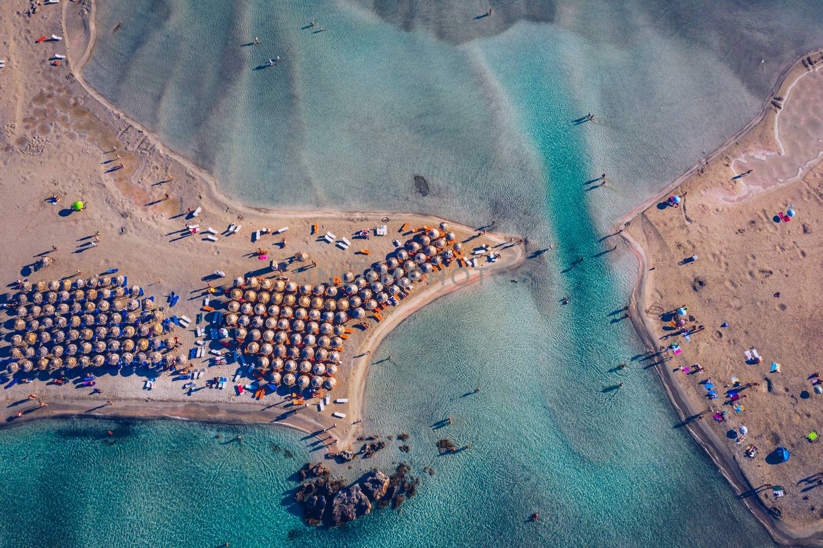 Aerial view of beautiful tropical Elafonissi Beach with pink sand. View of a nice tropical Elafonissi beach from the air. Beautiful sky, sea, resort. Elafonissi beach, Crete, Greece.