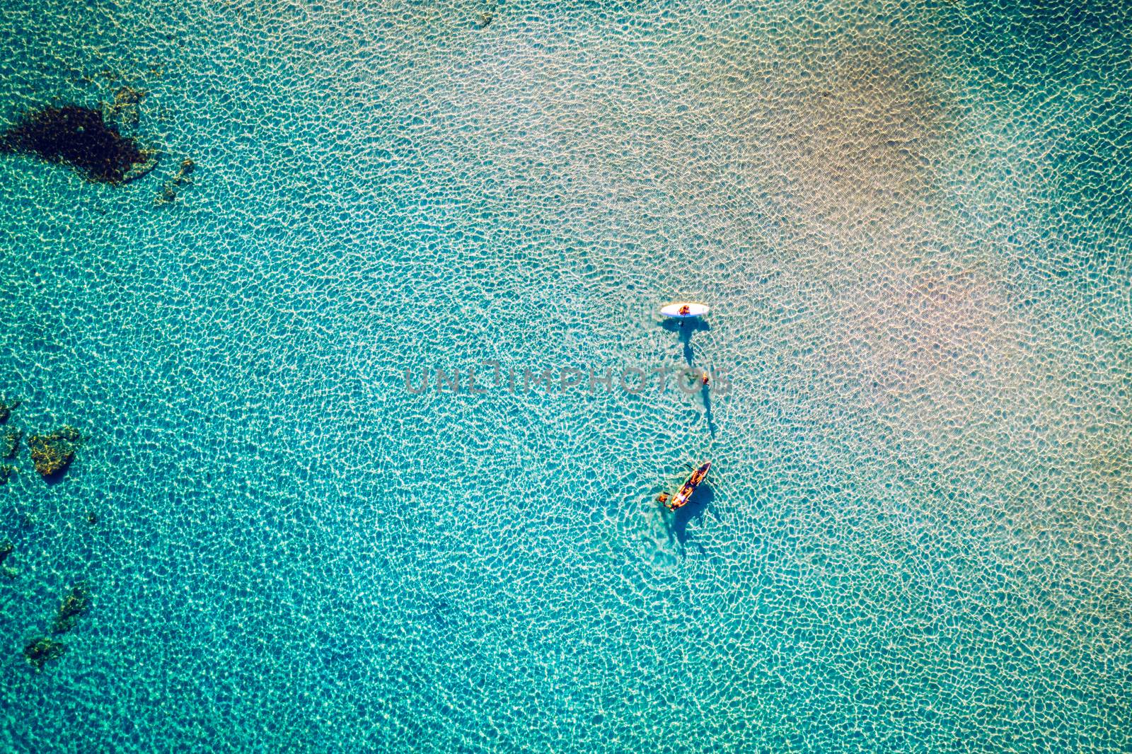 Aerial drone shot of beautiful turquoise beach with pink sand Elafonissi, Crete, Greece. Best beaches of Mediterranean, Elafonissi beach, Crete, Greece. Famous Elafonisi beach on Greece island, Crete.