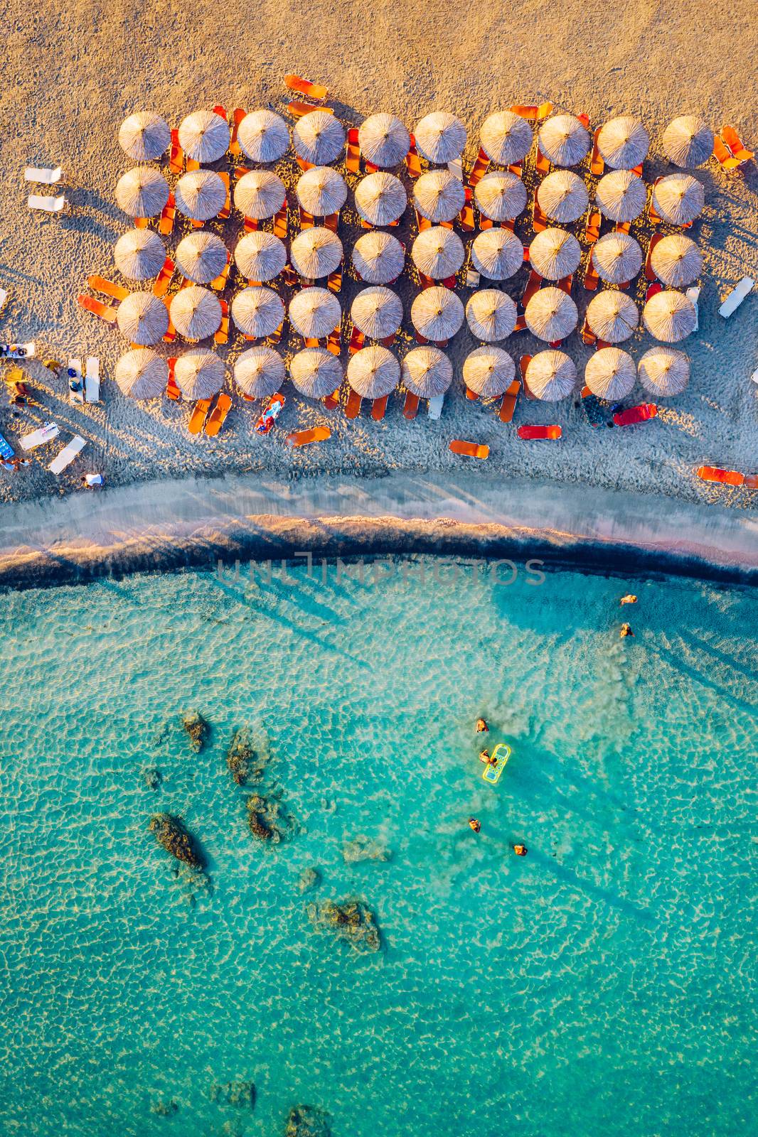 Aerial view of beautiful tropical Elafonissi Beach with pink sand. View of a nice tropical Elafonissi beach from the air. Beautiful sky, sea, resort. Elafonissi beach, Crete, Greece.