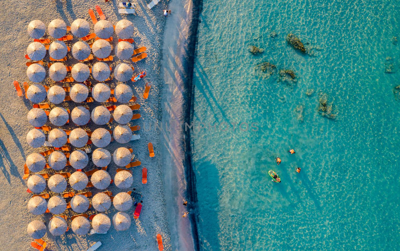 Aerial view of beautiful tropical Elafonissi Beach with pink sand. View of a nice tropical Elafonissi beach from the air. Beautiful sky, sea, resort. Elafonissi beach, Crete, Greece.