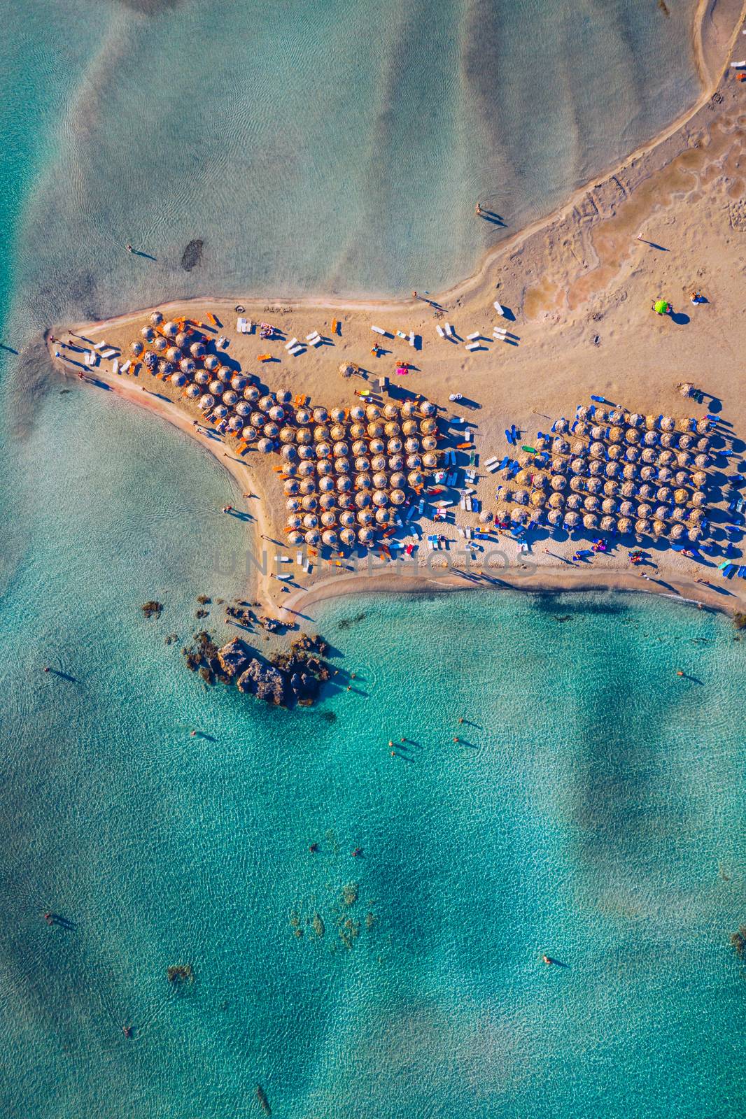 Aerial drone shot of beautiful turquoise beach with pink sand Elafonissi, Crete, Greece. Best beaches of Mediterranean, Elafonissi beach, Crete, Greece. Famous Elafonisi beach on Greece island, Crete.