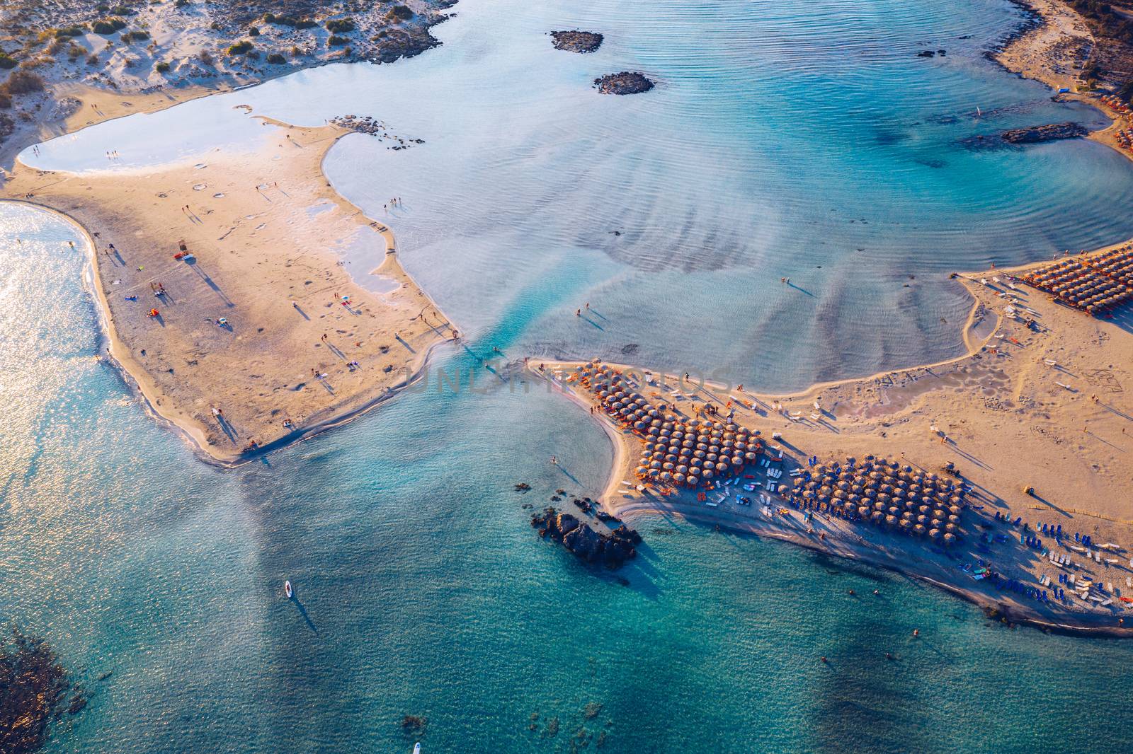 Aerial view of beautiful tropical Elafonissi Beach with pink sand. View of a nice tropical Elafonissi beach from the air. Beautiful sky, sea, resort. Elafonissi beach, Crete, Greece.