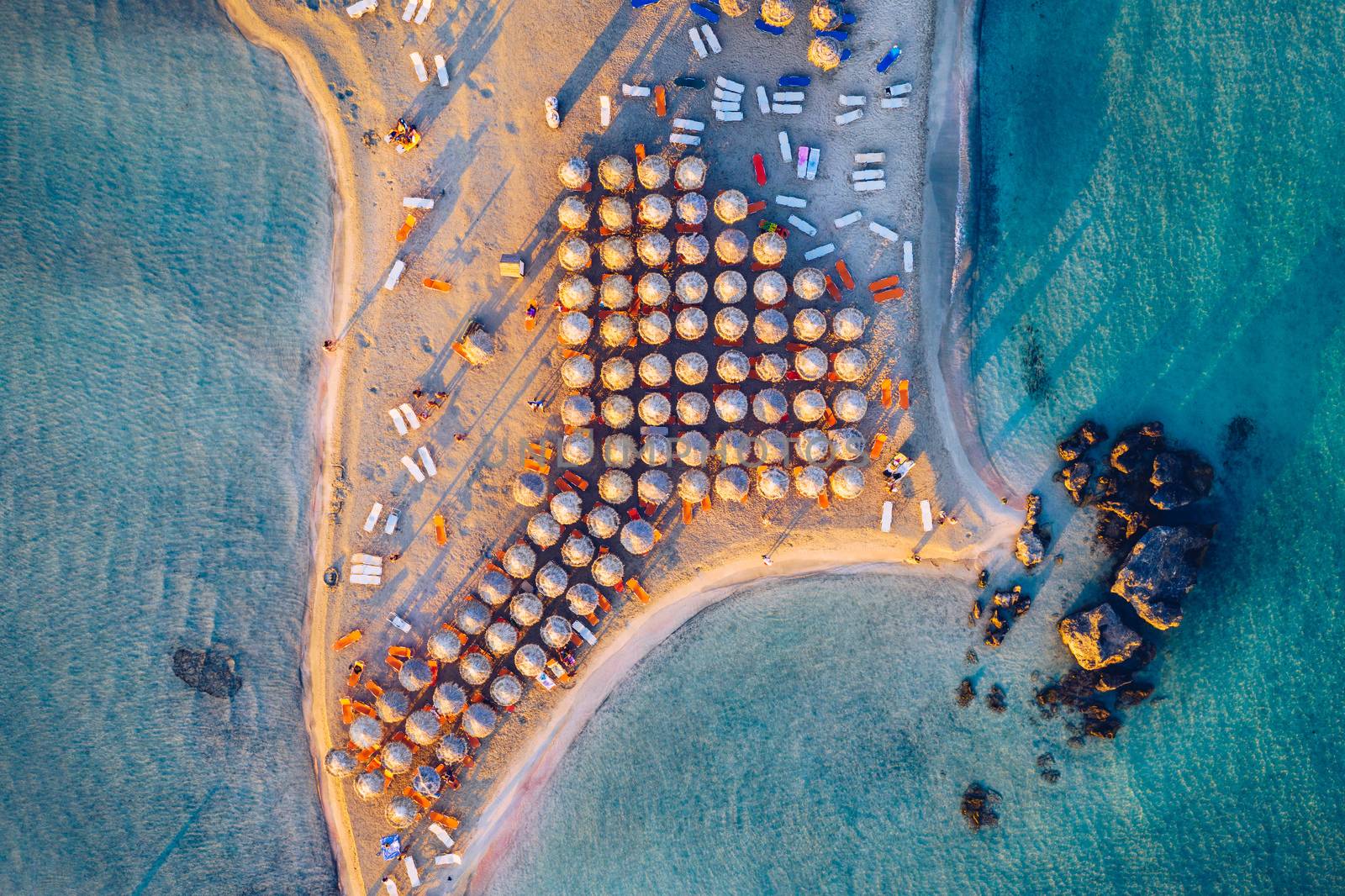 Aerial view of beautiful tropical Elafonissi Beach with pink sand. View of a nice tropical Elafonissi beach from the air. Beautiful sky, sea, resort. Elafonissi beach, Crete, Greece.