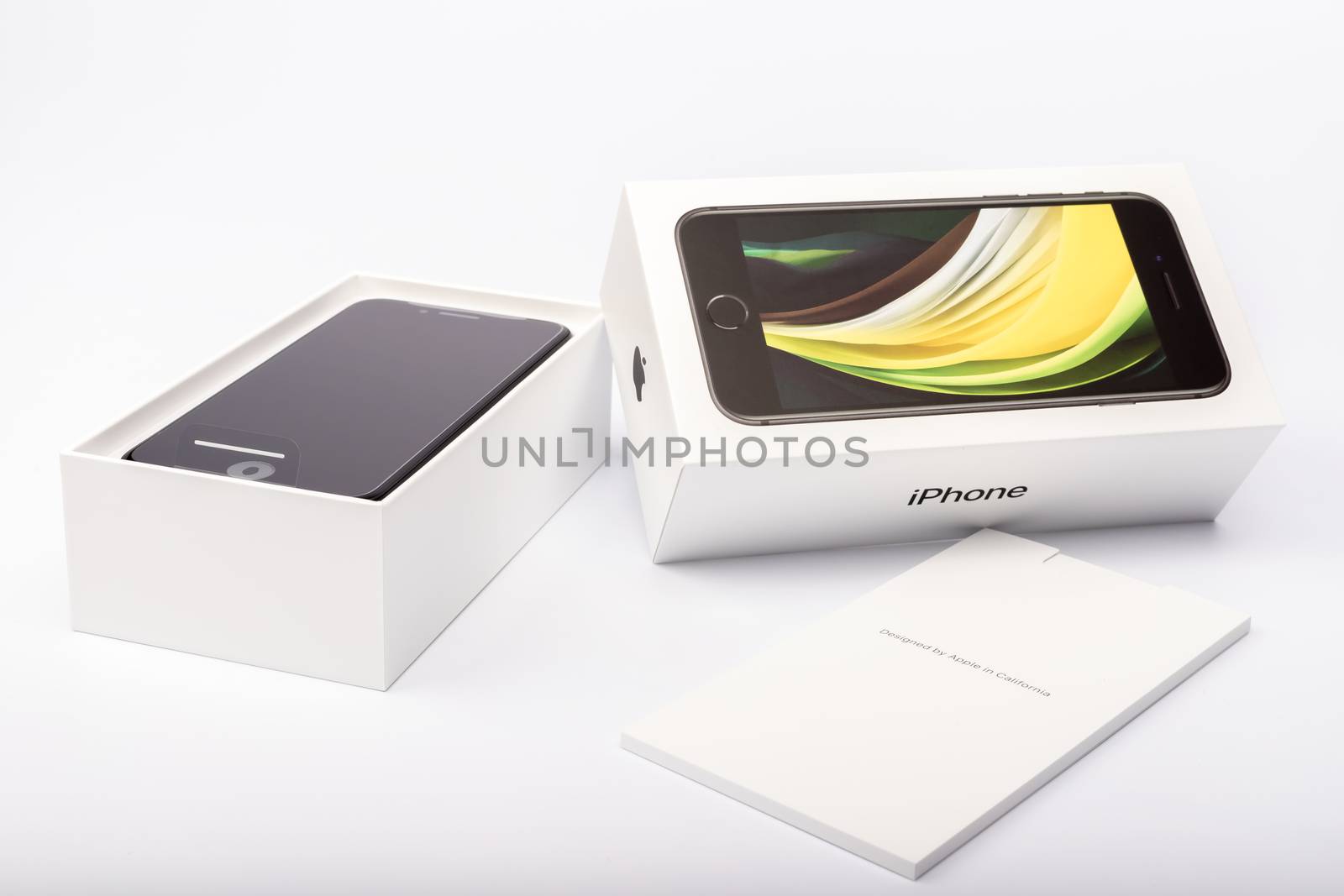 Paris, France - May 14, 2020: packaging of the new black iPhone SE 2020 from the multinational company Apple during the days of its studio release on a white background