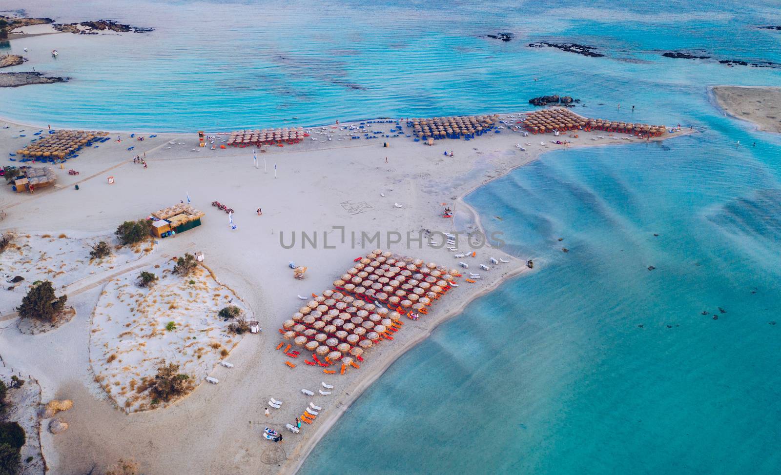 Aerial view of beautiful tropical Elafonissi Beach with pink sand. View of a nice tropical Elafonissi beach from the air. Beautiful sky, sea, resort. Elafonissi beach, Crete, Greece.