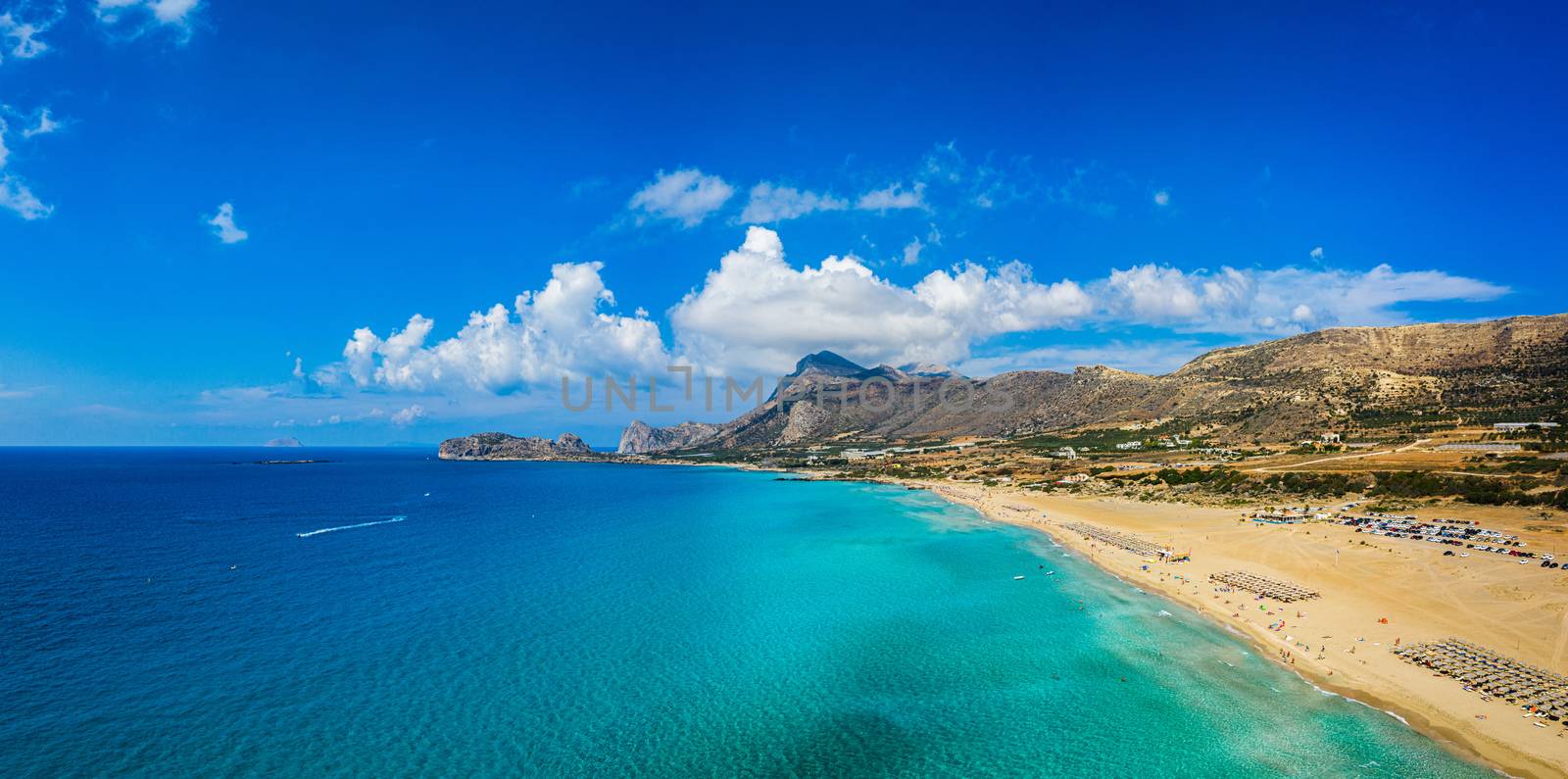 Aerial shot of beautiful turquoise beach Falasarna (Falassarna) in Crete, Greece. View of famous paradise sandy deep turquoise beach of Falasarna (Falassarna) in North West, Crete island, Greece.