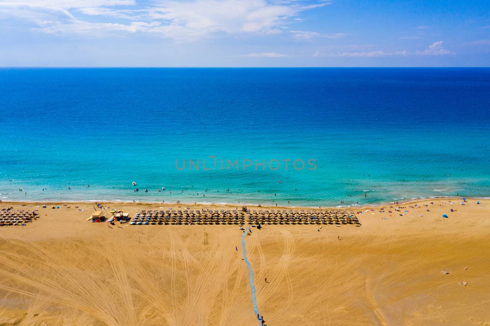 Aerial shot of beautiful turquoise beach Falasarna (Falassarna) in Crete, Greece. View of famous paradise sandy deep turquoise beach of Falasarna (Falassarna) in North West, Crete island, Greece.