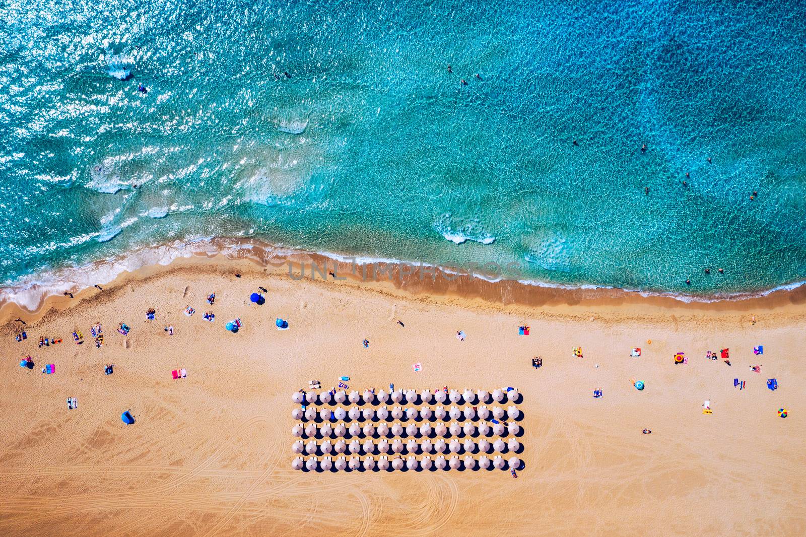 Aerial shot of beautiful turquoise beach Falasarna (Falassarna) in Crete, Greece. View of famous paradise sandy deep turquoise beach of Falasarna (Falassarna) in North West, Crete island, Greece.