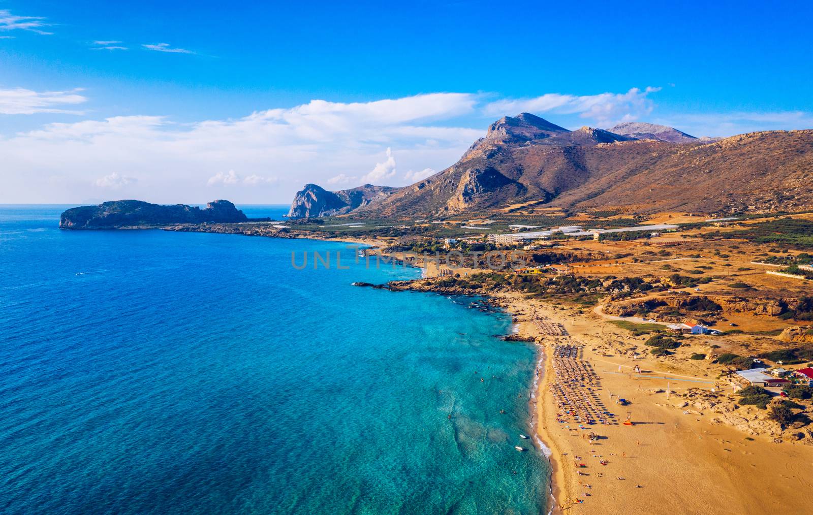 Aerial shot of beautiful turquoise beach Falasarna (Falassarna) in Crete, Greece. View of famous paradise sandy deep turquoise beach of Falasarna (Falassarna) in North West, Crete island, Greece.