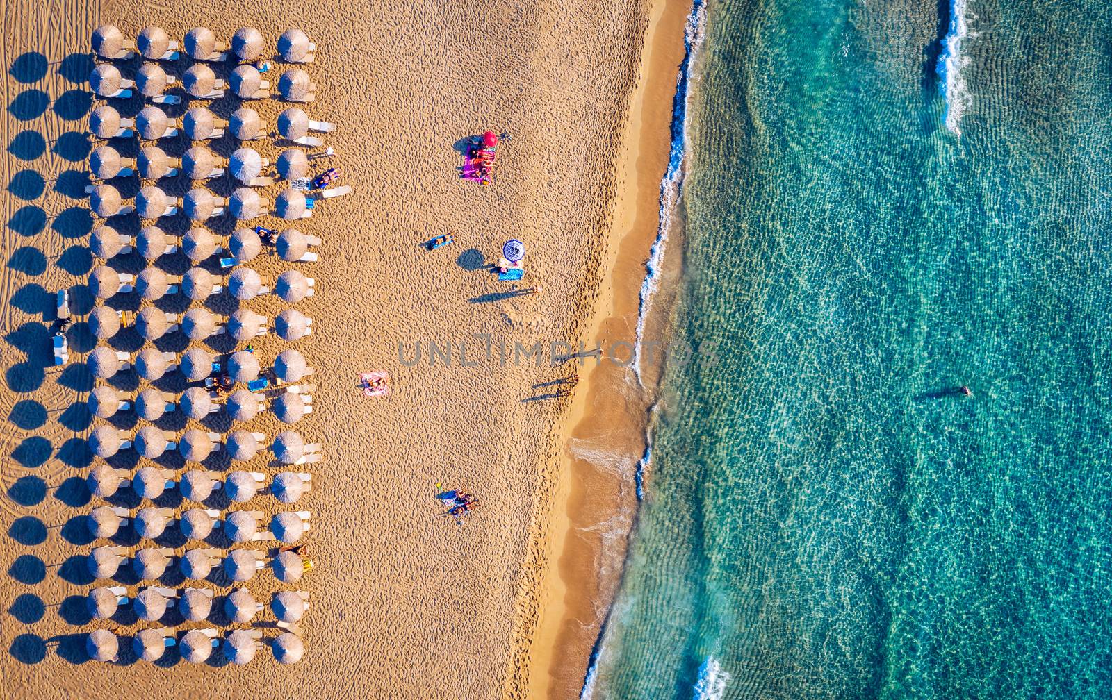 Aerial shot of beautiful turquoise beach Falasarna (Falassarna) in Crete, Greece. View of famous paradise sandy deep turquoise beach of Falasarna (Falassarna) in North West, Crete island, Greece.