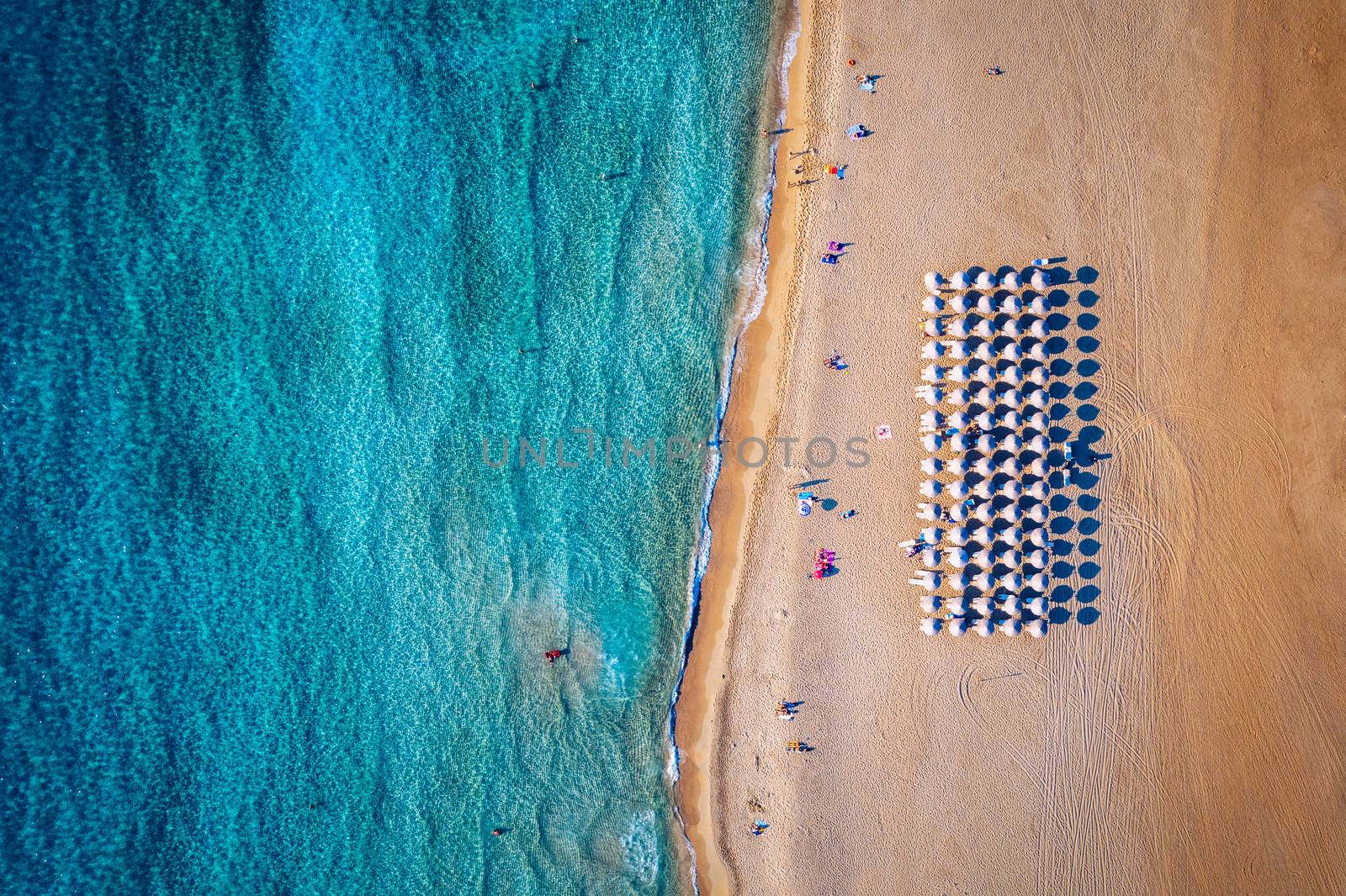 Aerial shot of beautiful turquoise beach Falasarna (Falassarna) in Crete, Greece. View of famous paradise sandy deep turquoise beach of Falasarna (Falassarna) in North West, Crete island, Greece.