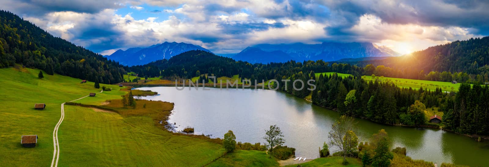 View from flying drone. Astonishing evening view of Wagenbruchsee (Geroldsee) lake with Westliche Karwendelspitze mountain range on background, Bavarian Alps, Germany, Europe.