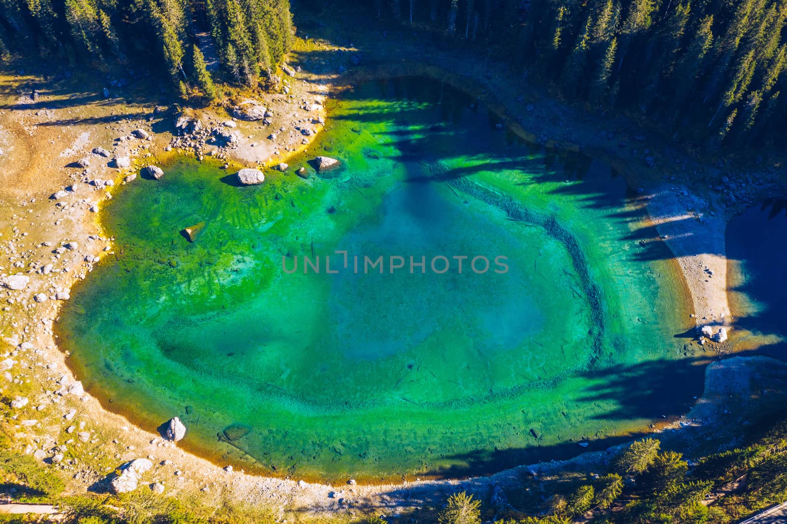 Carezza lake (Lago di Carezza, Karersee) with Mount Latemar, Bolzano province, South tyrol, Italy. Landscape of Lake Carezza or Karersee and Dolomites in background, Nova Levante, Bolzano, Italy.