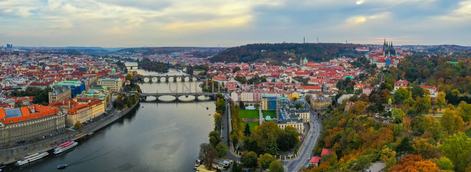 Aerial Prague panoramic drone view of the city of Prague at the Old Town Square, Czechia. Prague Old Town pier architecture and Charles Bridge over Vltava river in Prague at sunset, Czech Republic. 
