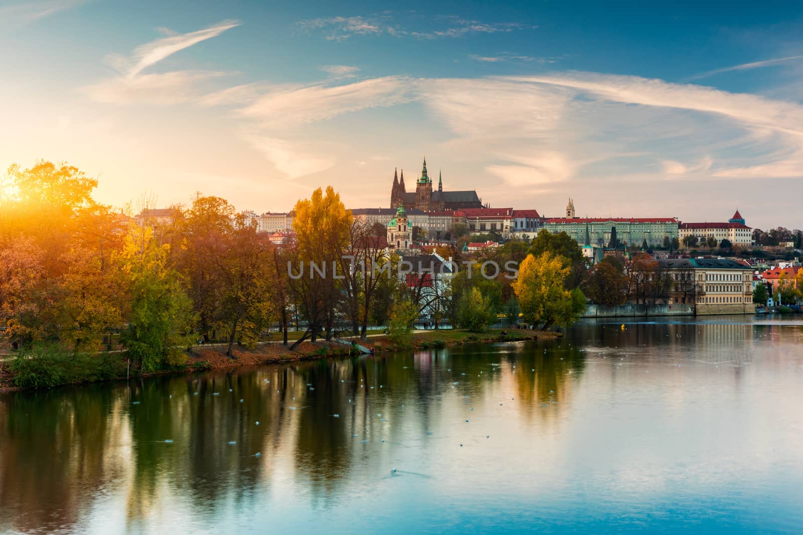 Prague autumn landscape. Prague autumn landscape view to Saint Vitus cathedral. Prague. Prague panorama. Prague, Czech Republic. Scenic autumn aerial view of the Old Town with red foliage. Czechia.